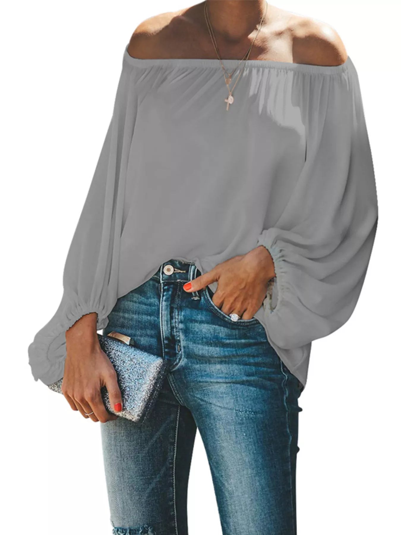 Off-shoulder balloon sleeve blouse from Trendsi, featuring a stylish design with puffed sleeves and a relaxed fit.