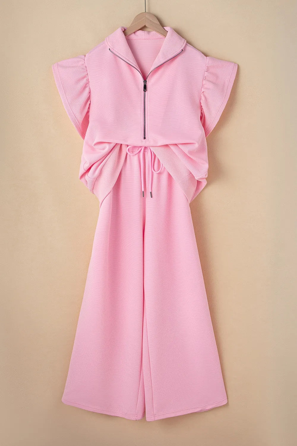 Textured ruffled sleeve zip-up top and wide leg pants set by Trendsi, shown in a stylish fashion ensemble.