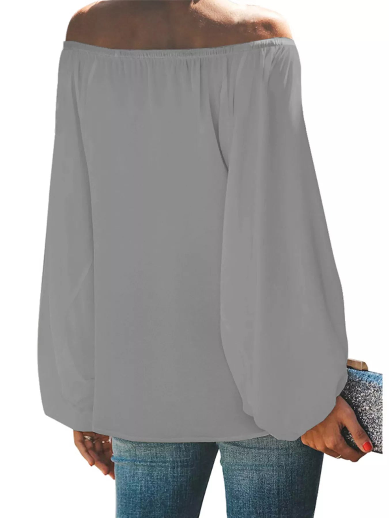 Off-shoulder balloon sleeve blouse from Trendsi, featuring a stylish design with puffed sleeves and a relaxed fit.