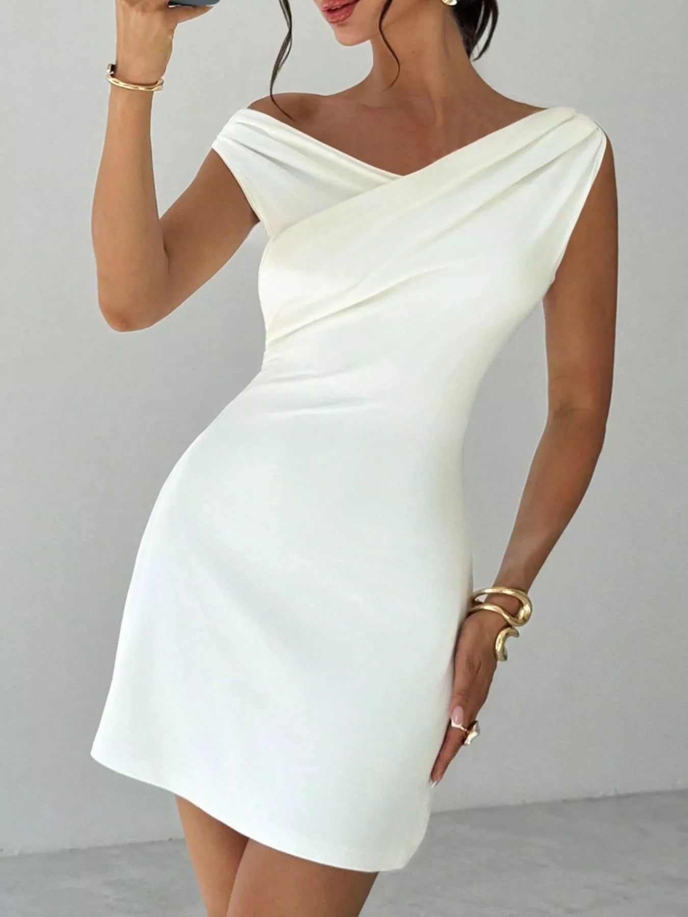 Elegant off-shoulder draped mini dress from Trendsi, perfect for after 5 events, featuring stylish and sophisticated design.