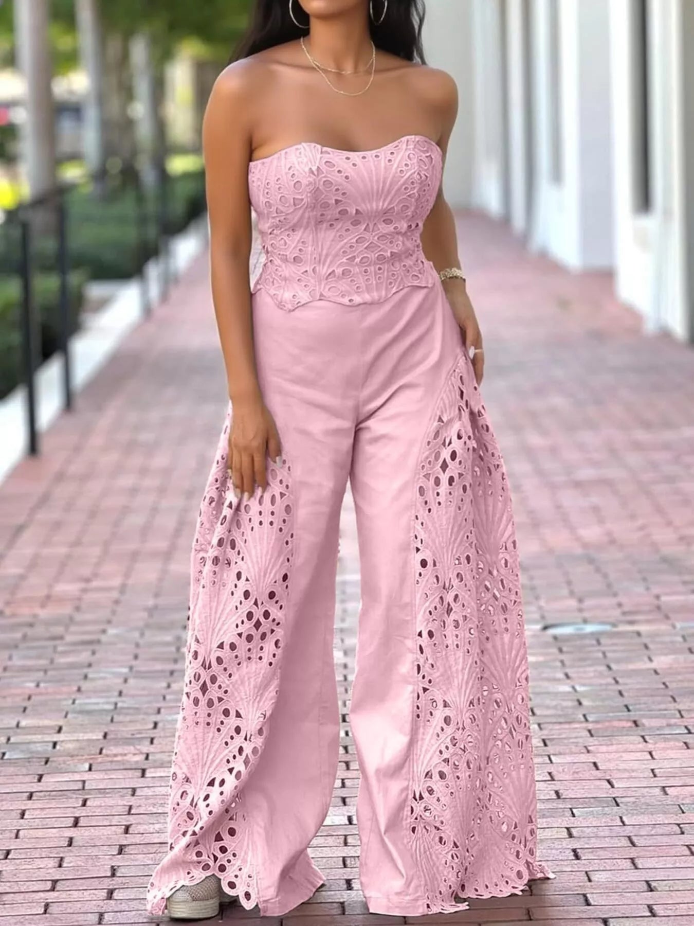 Hollow-out tube top and matching pants set by Trendsi, stylish 2-piece outfit with cut-out design, perfect for casual or trendy looks.
