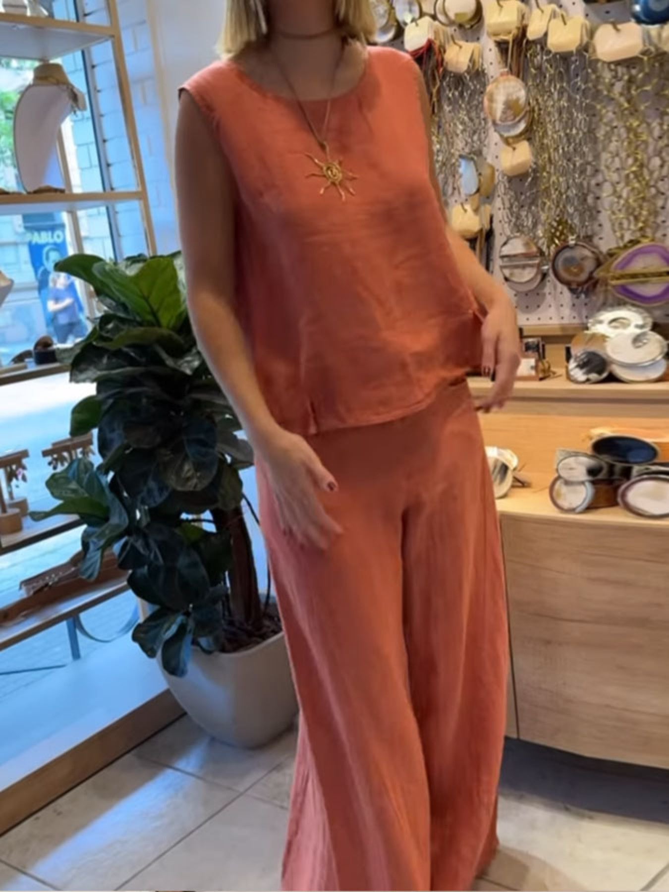Casual round neck tank top and matching pants set by Trendsi, featuring a relaxed fit and comfortable fabric.