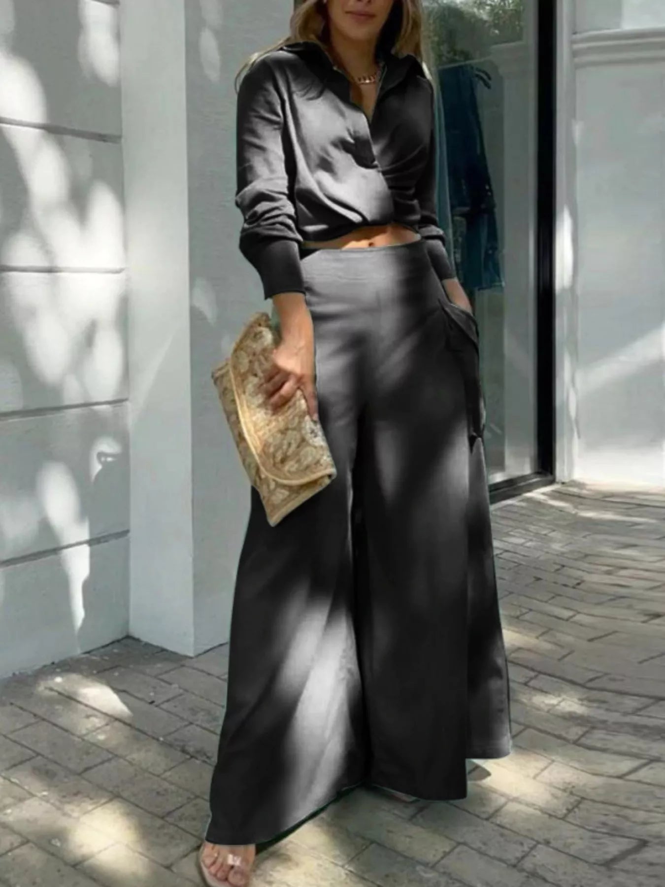 Button front shirt with chest pocket and wide-leg pants set from Trendsi, featuring a coordinated, stylish casual outfit.