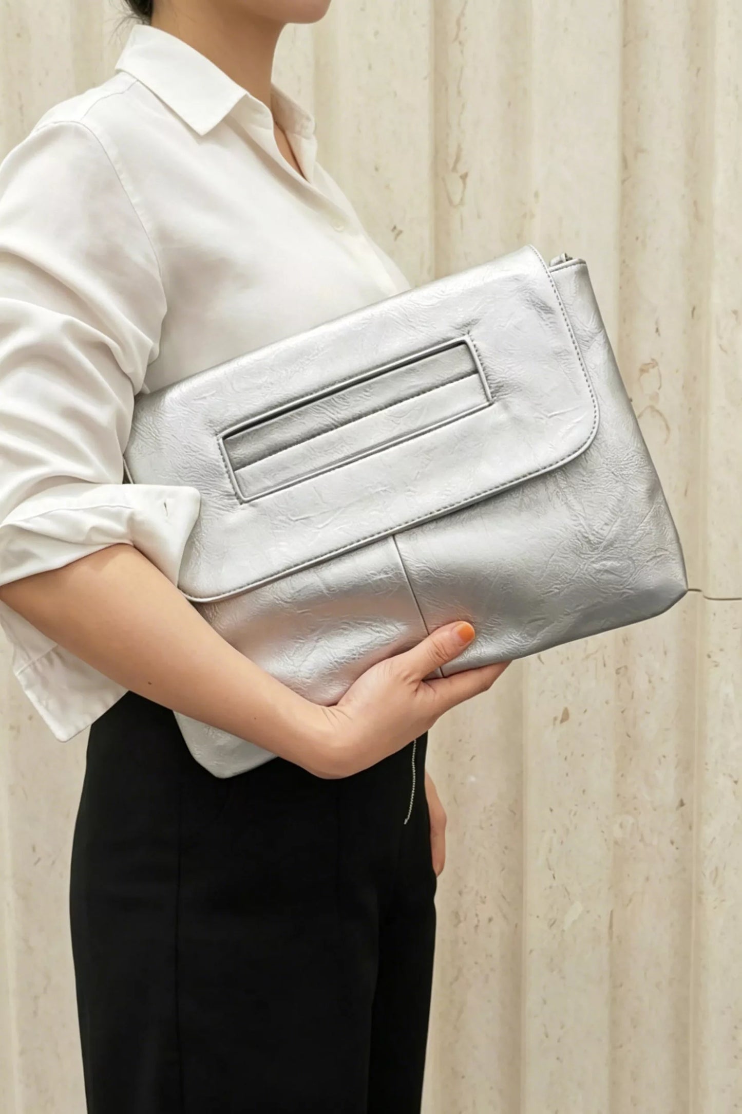 Vintage style envelope clutch handbag by Trendsi, featuring a sleek design and classic envelope flap in neutral tones.