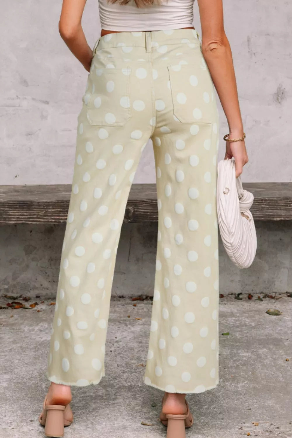 Polka dot high-waisted wide leg jeans from Trendsi, featuring a stylish pattern and relaxed fit with wide legs.