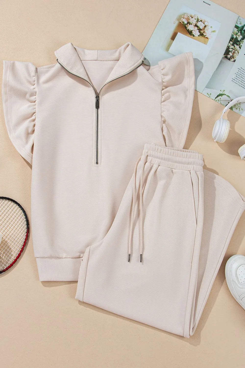 Textured ruffled sleeve zipped top and wide-leg pants set from Trendsi, featuring stylish design and comfortable fit.