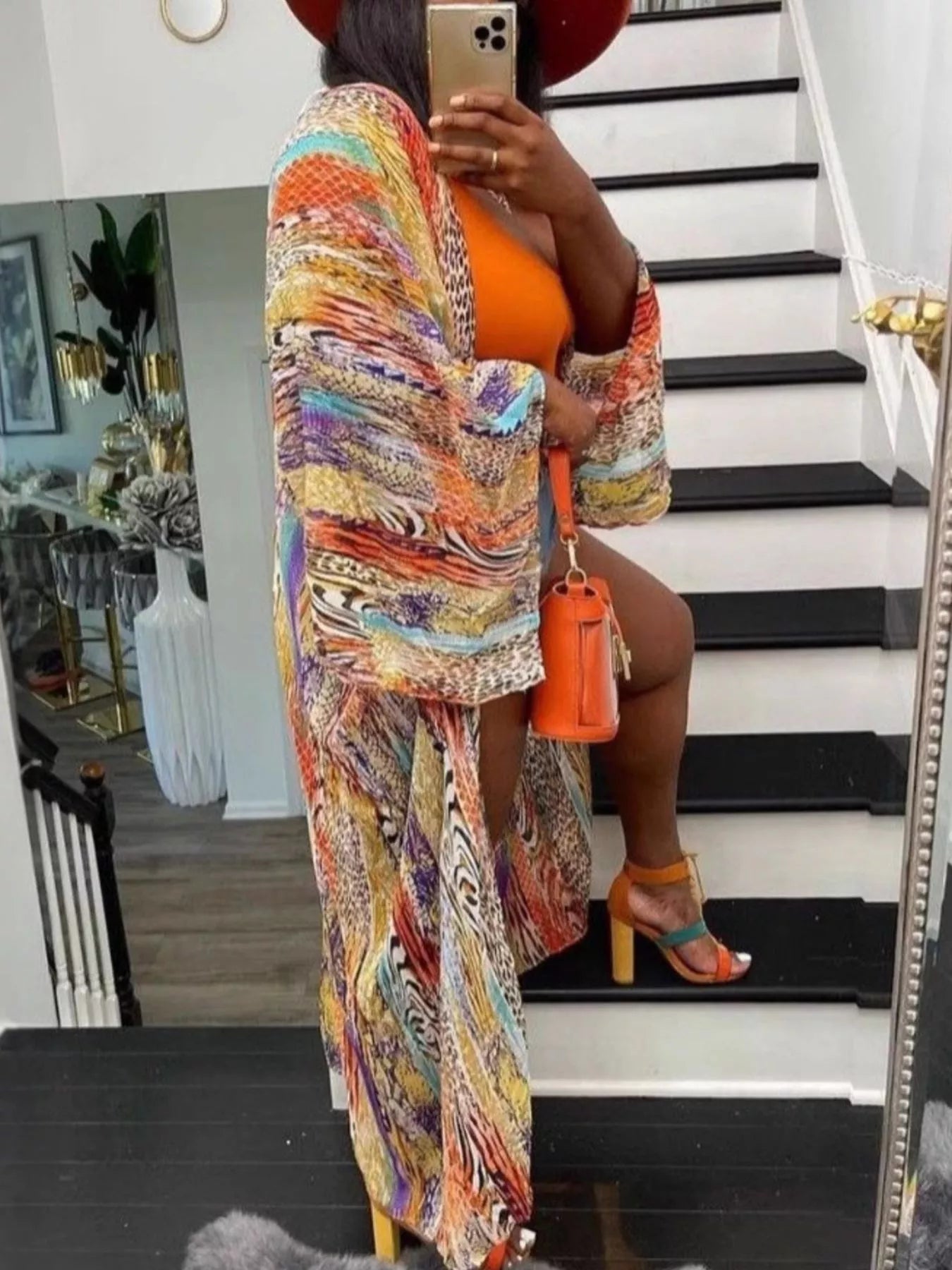 Bohemian orange print flowy cardigan by Trendsi, featuring lightweight fabric and relaxed fit, perfect for casual and boho styles.