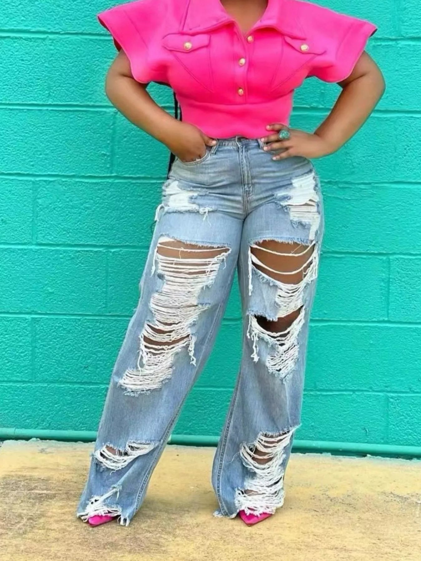 Distressed wide leg denim jeans by Trendsi featuring a relaxed fit, ripped details, and a vintage-inspired style.