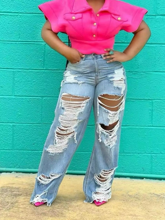 Distressed wide leg denim jeans by Trendsi featuring a relaxed fit, ripped details, and a vintage-inspired style.
