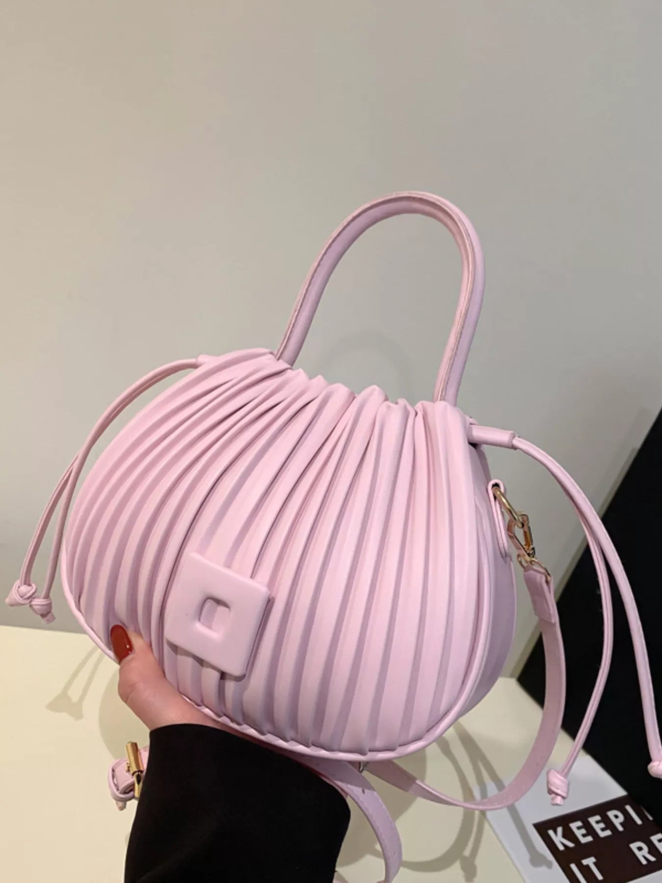 Trendsi pleated bucket crossbody bag with adjustable strap, featuring a stylish pleated design and compact handbag style.
