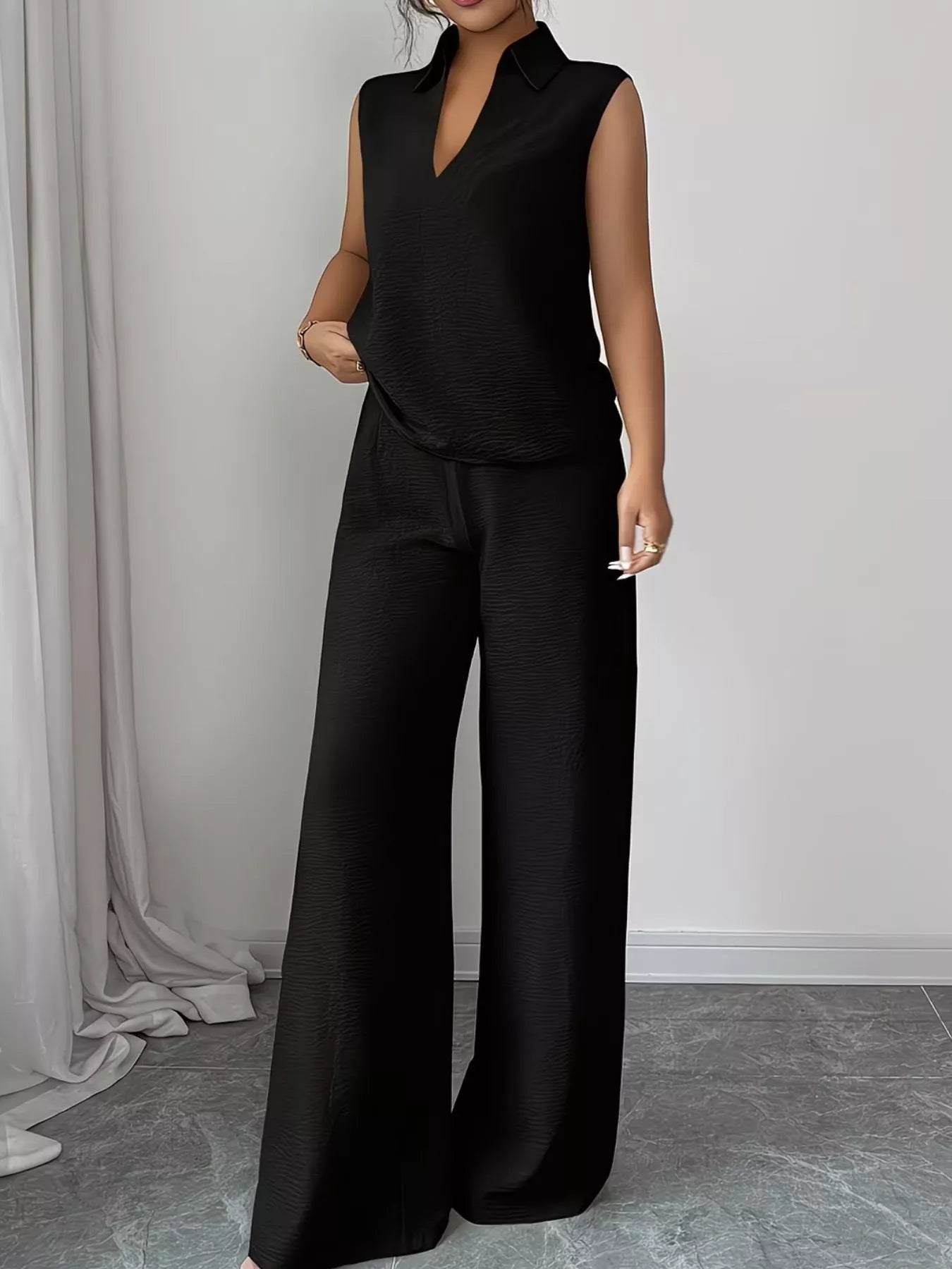 V-neck sleeveless top and wide-leg pants set by Trendsi, featuring a stylish and comfortable matching outfit in soft fabric.