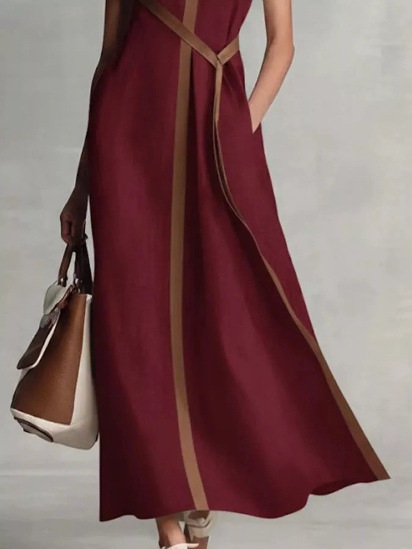 Sleeveless maxi dress by Trendsi featuring contrast trim, flowing fabric, and a stylish, elegant design perfect for summer wear.