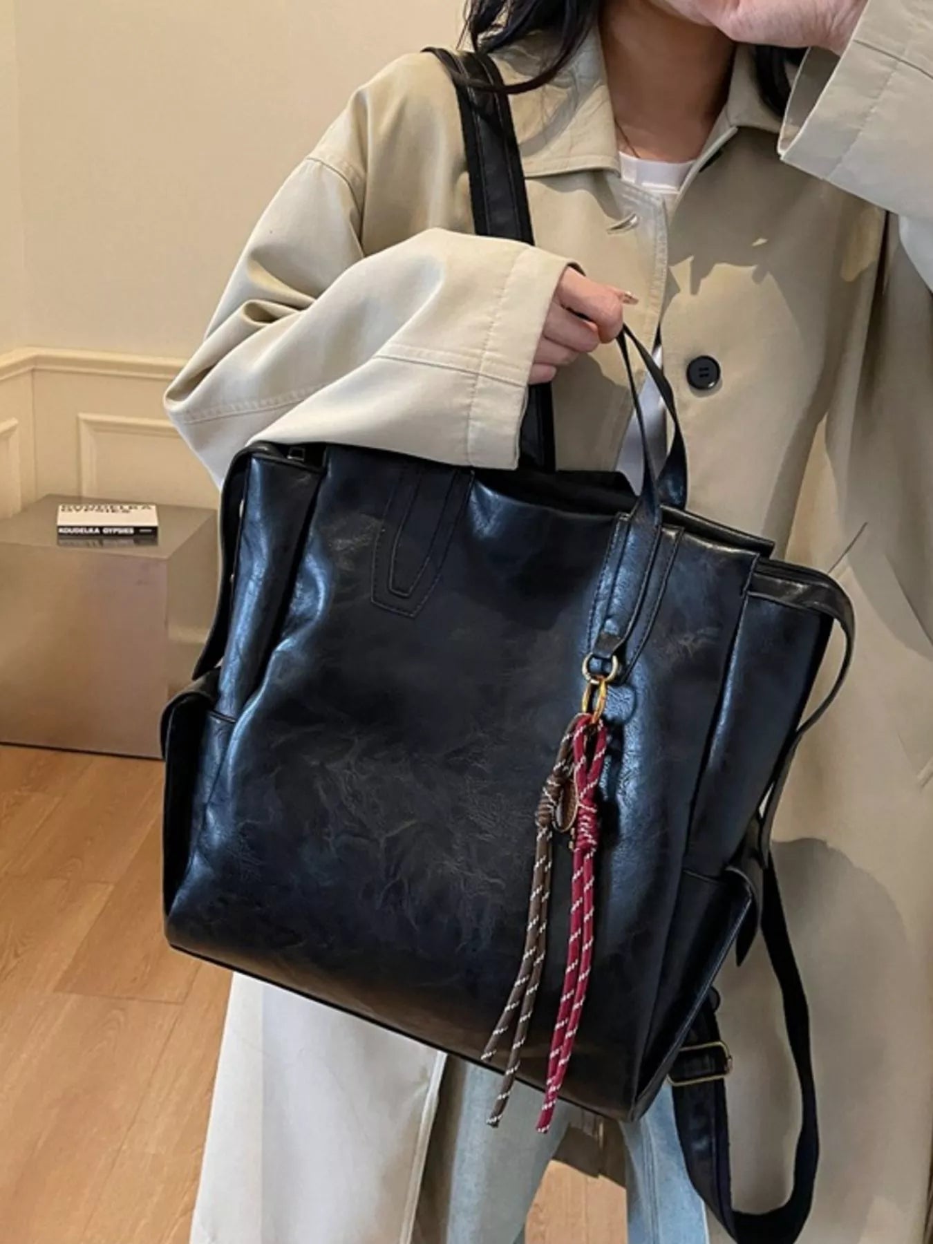 Vintage leather convertible backpack bag by Trendsi, showing its adjustable straps, classic design, and durable leather material.