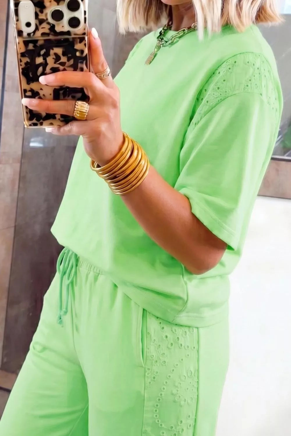 Lace patchwork half sleeve top and elastic waist pants two-piece loungewear set by Trendsi, shown in a relaxed fit.