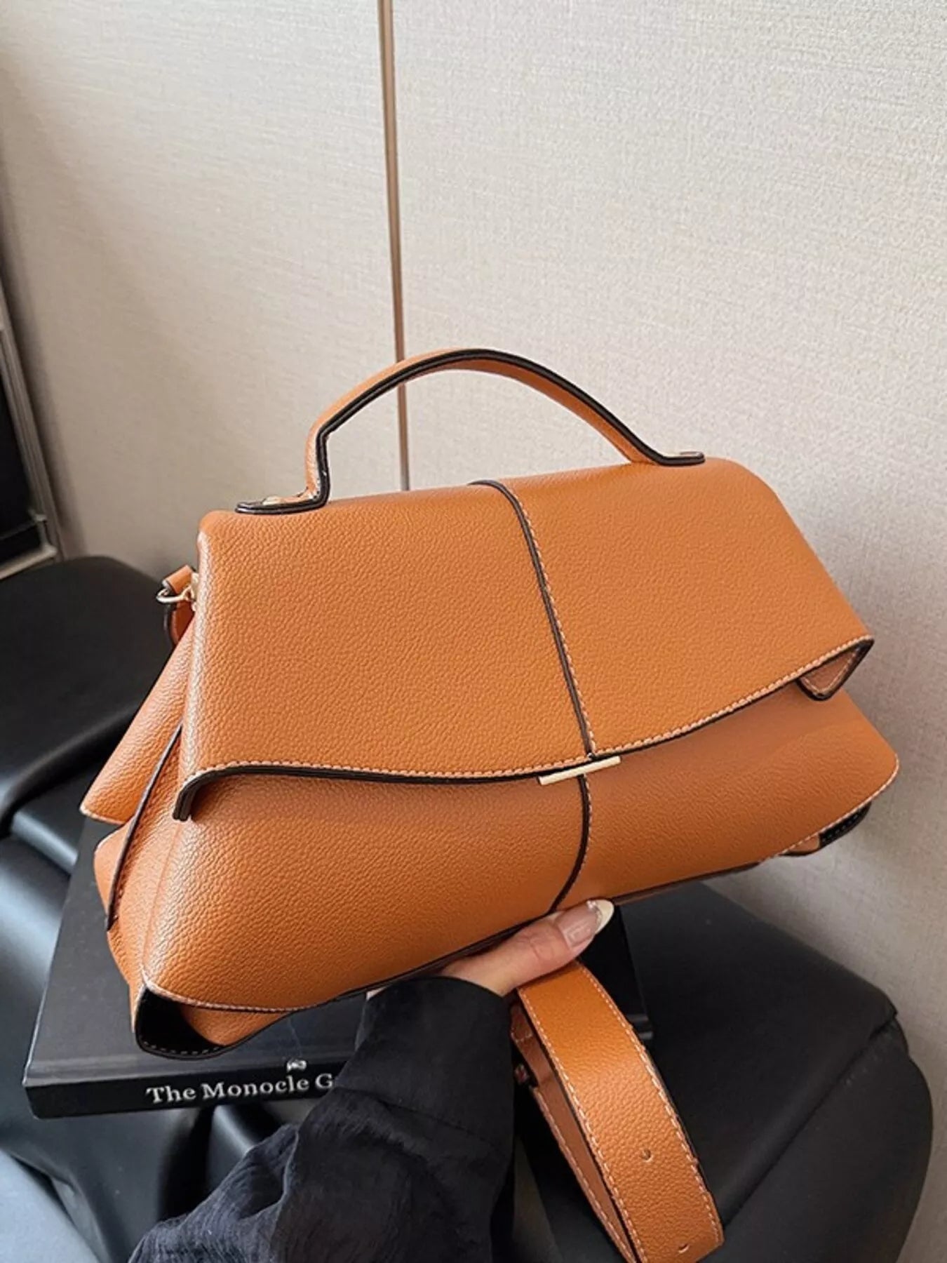 Geometric flap shoulder bag from Trendsi, stylish handbag with modern design and structured shape, black with clean lines and flap closure.
