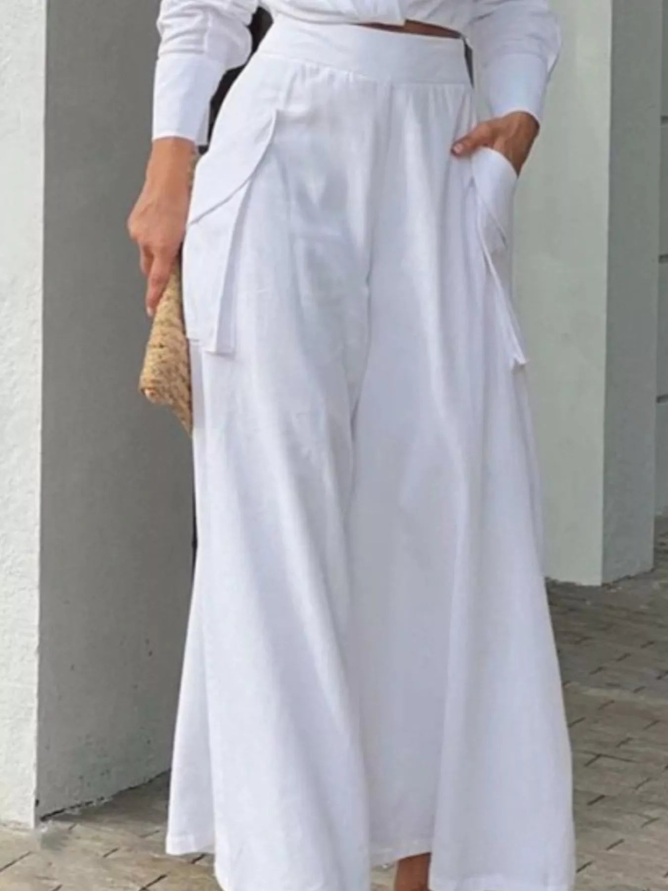 Button front shirt with chest pocket and matching wide-leg pants set by Trendsi, shown in a stylish, casual outfit.