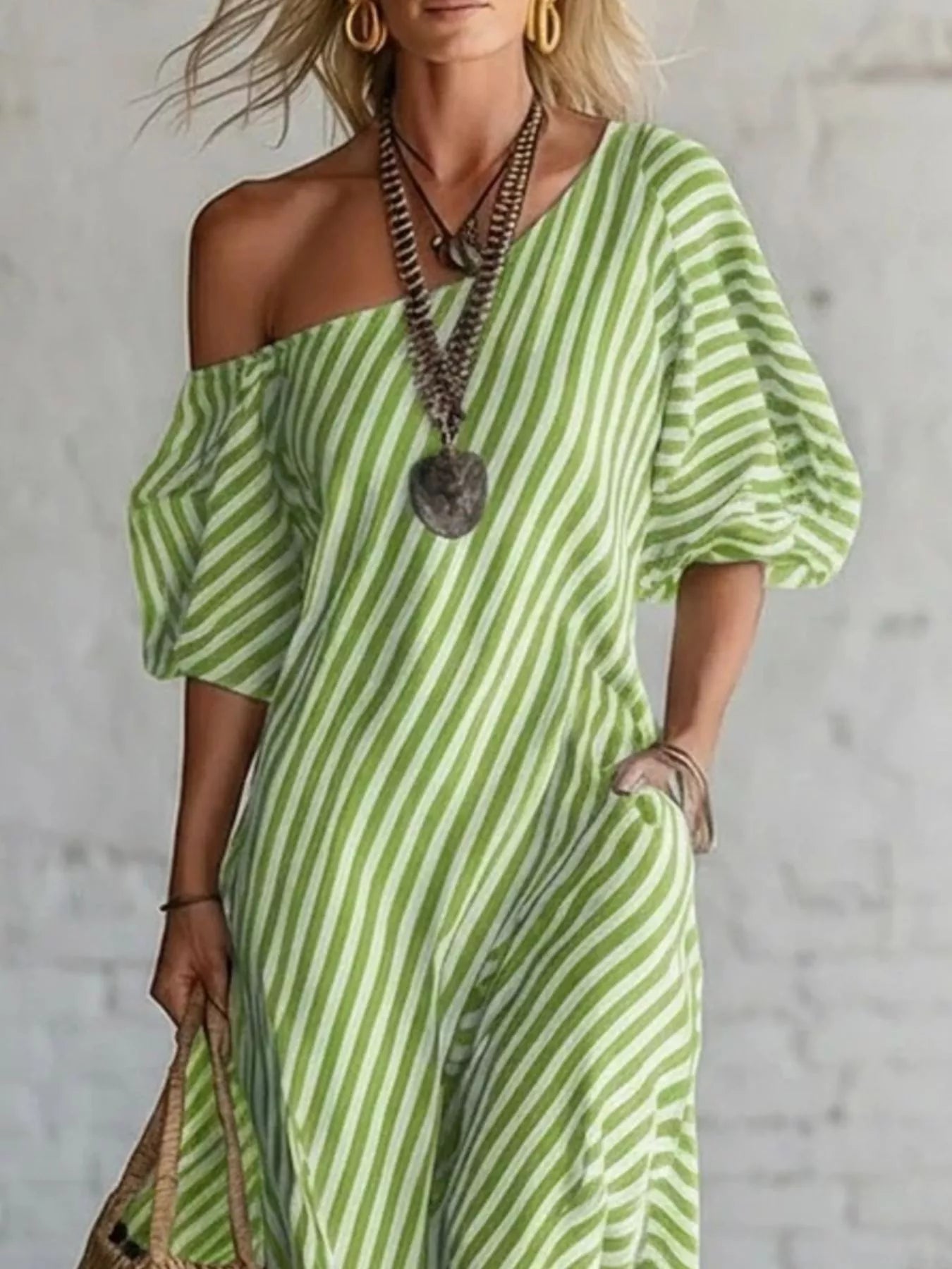 Striped one-shoulder maxi dress from Trendsi featuring bold vertical stripes and flowing fabric, perfect for summer wear.