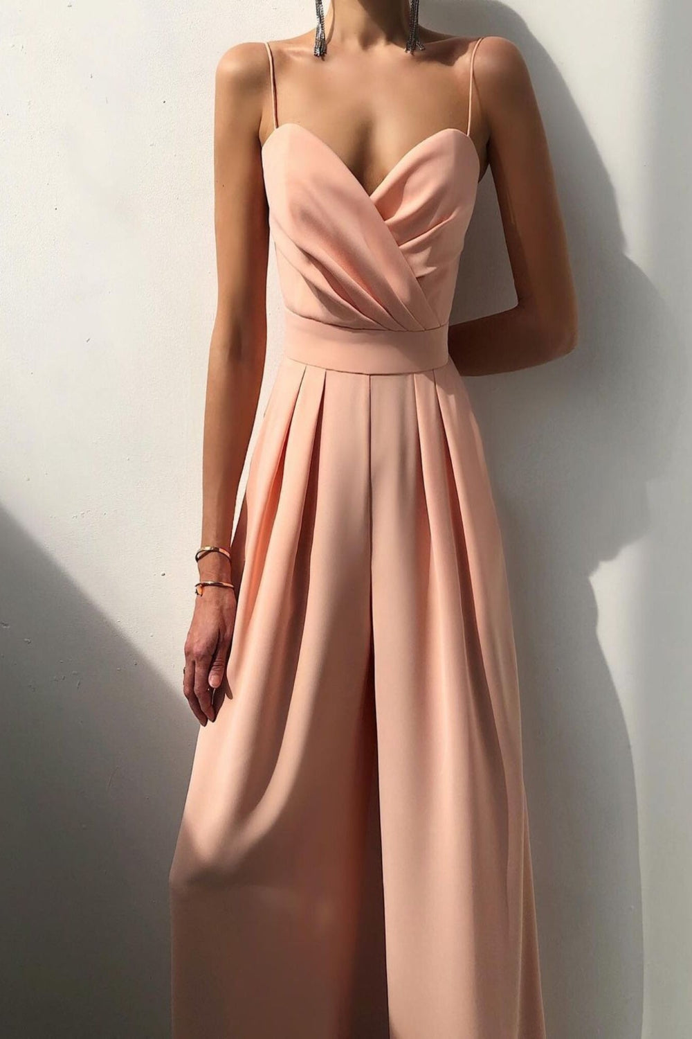 Trendsi spaghetti strap wide-leg jumpsuit featuring a fitted bodice and flowing pant legs, perfect for stylish summer wear.