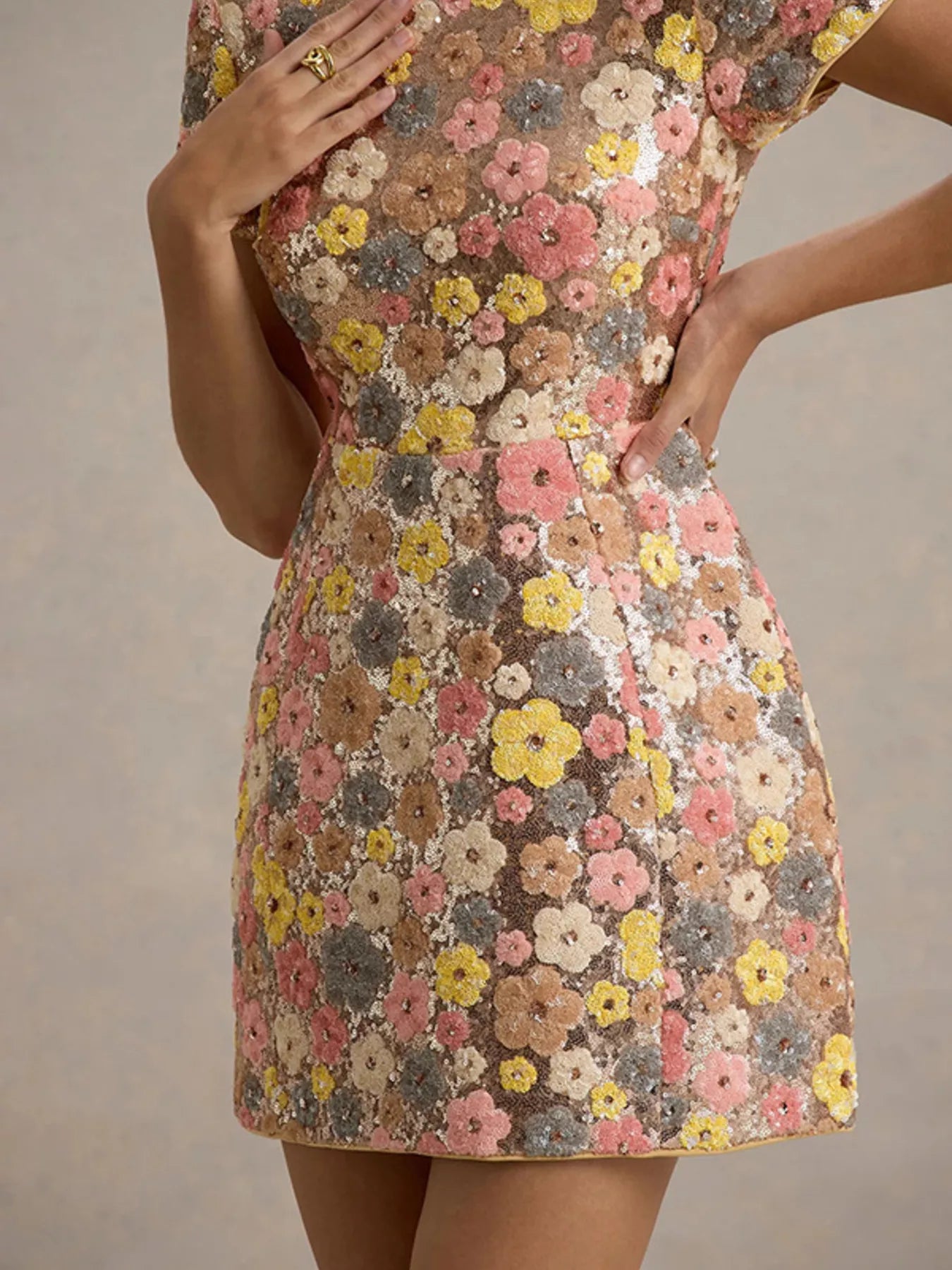 Floral sequin short sleeve mini dress from Trendsi with vibrant floral pattern and sparkling sequins, perfect for summer occasions.