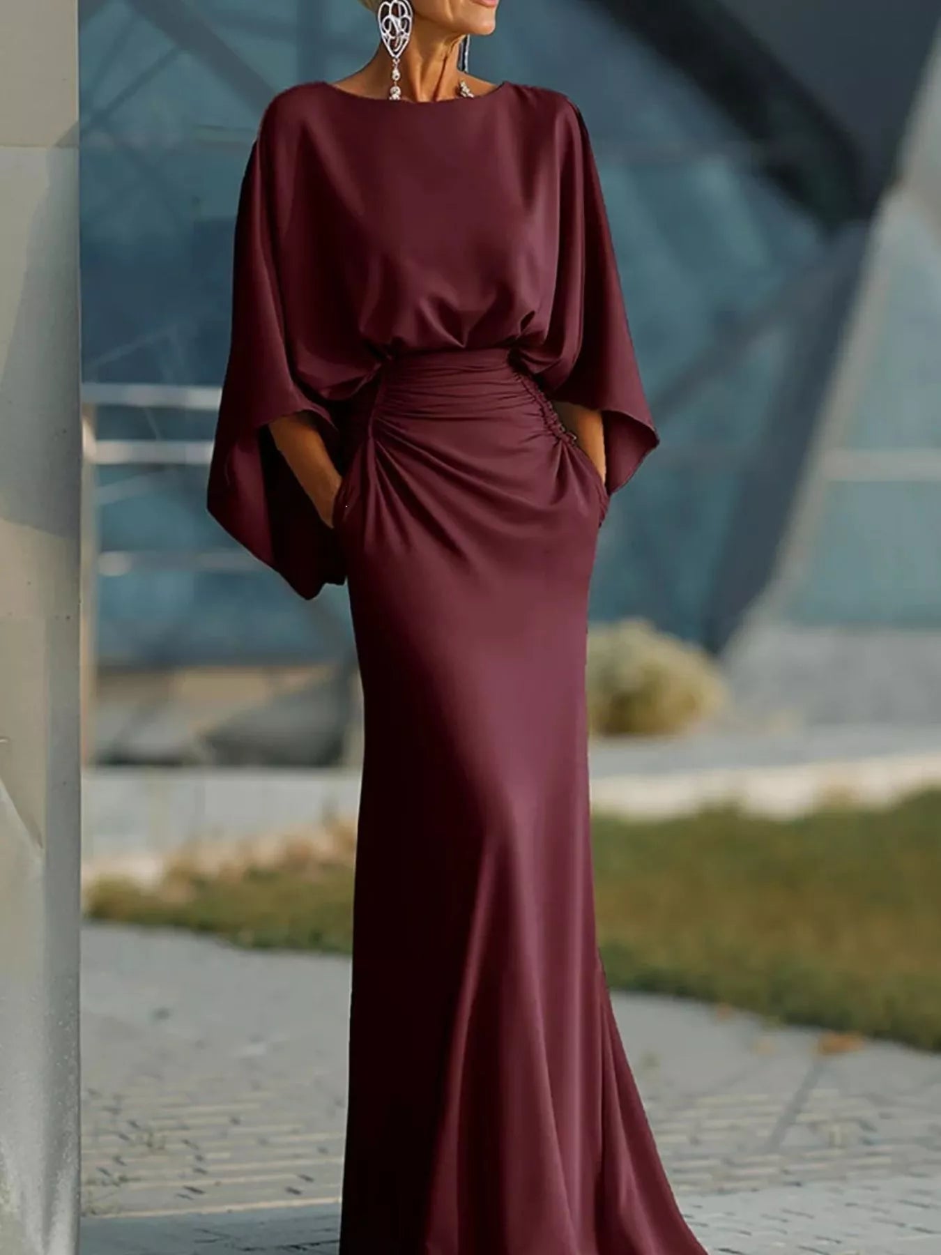 Batwing sleeve ruched evening dress by Trendsi featuring elegant draping and fitted silhouette in a sleek fabric.