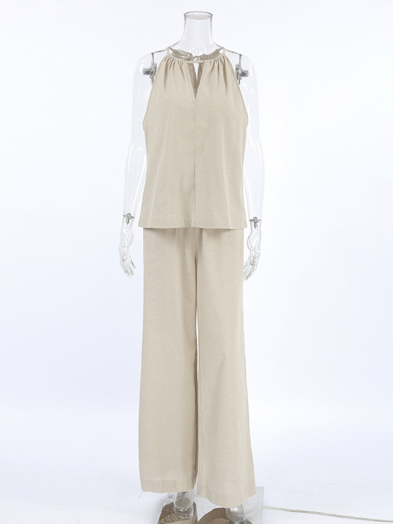 Trendsi cutout tank top paired with wide-leg pants set, featuring a stylish sleeveless top and flowy pants in a trendy outfit.