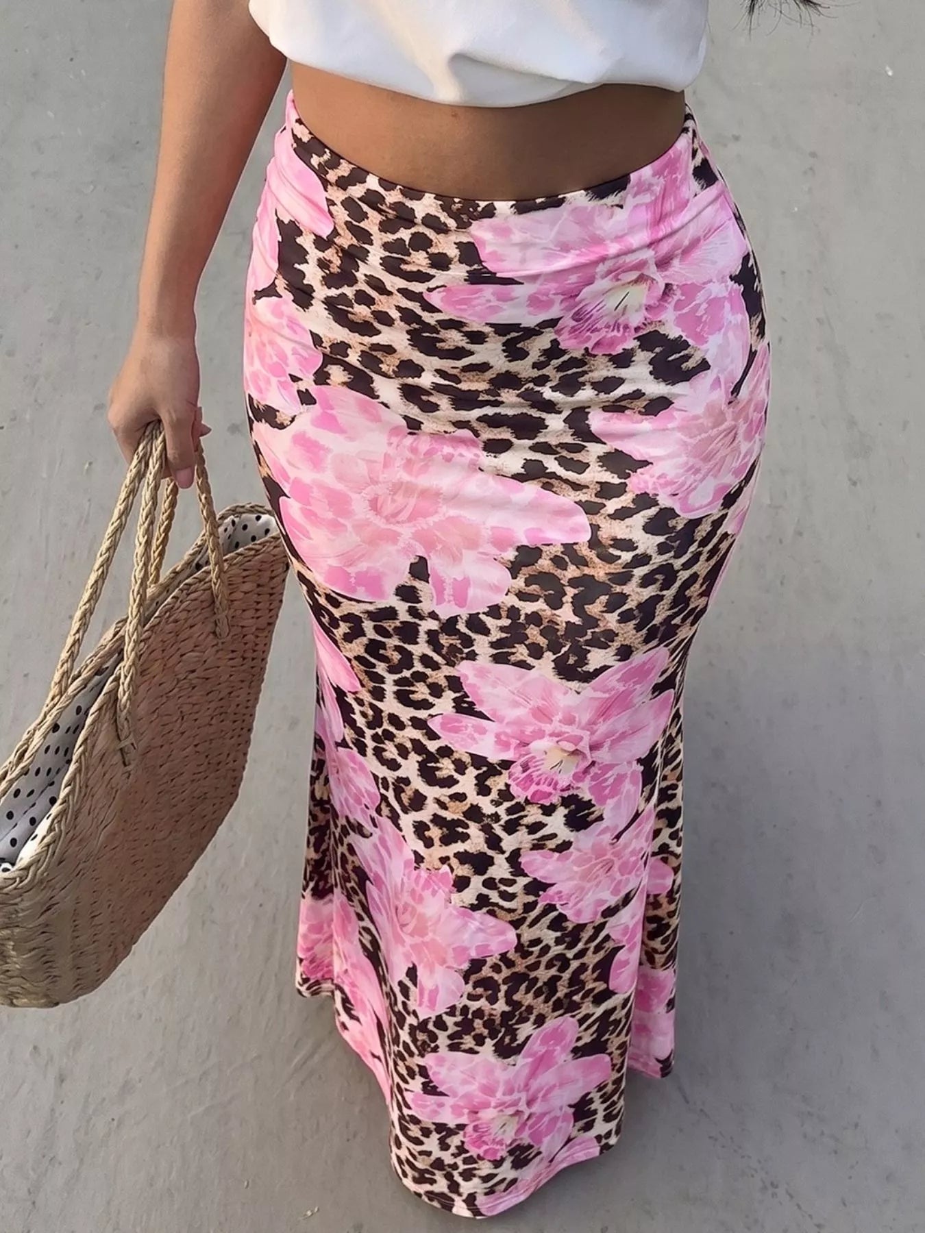 Leopard print bodycon maxi skirt from Trendsi, fitted design with bold animal pattern and high waist, shown on a model.