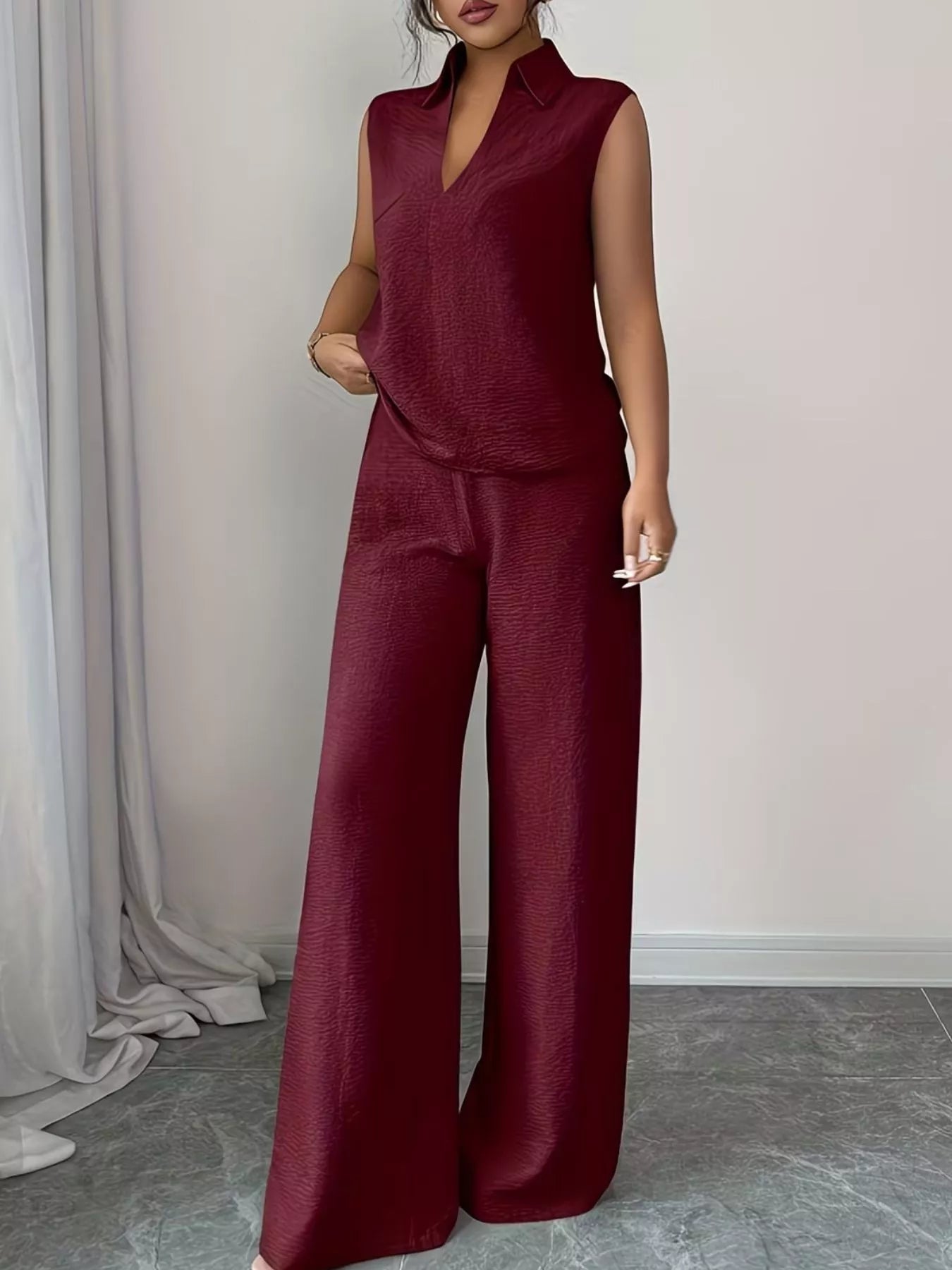 V-neck sleeveless top and wide-leg pants set by Trendsi, featuring a stylish matching outfit in a sleek, modern design.