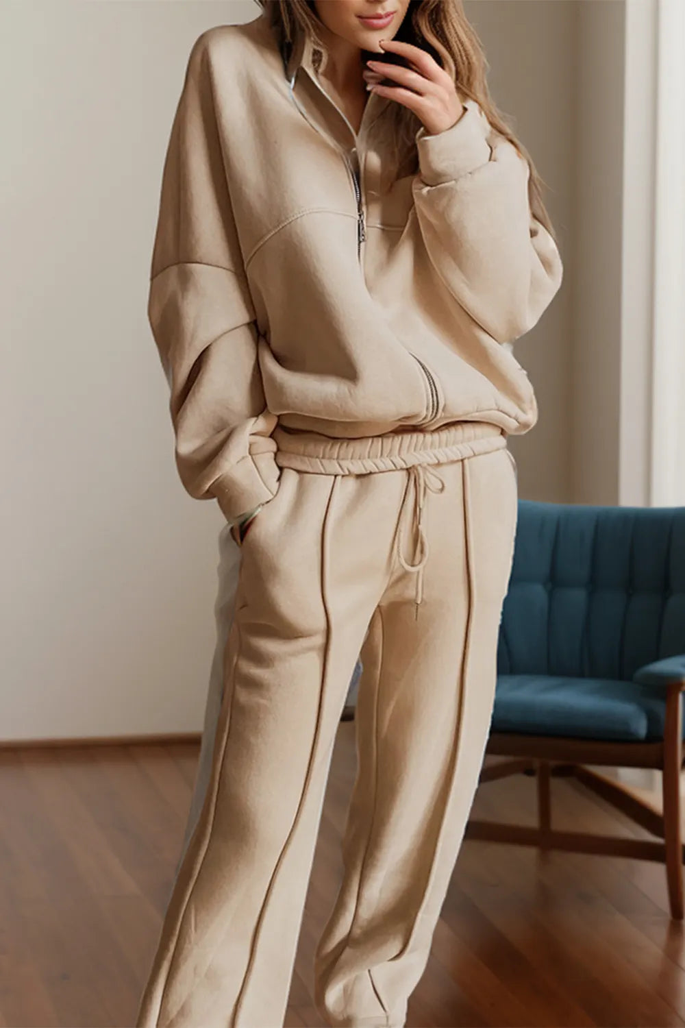 Trendsi zip-up long sleeve top and matching pants set in soft fabric, shown in a neutral color, casual and comfortable style.
