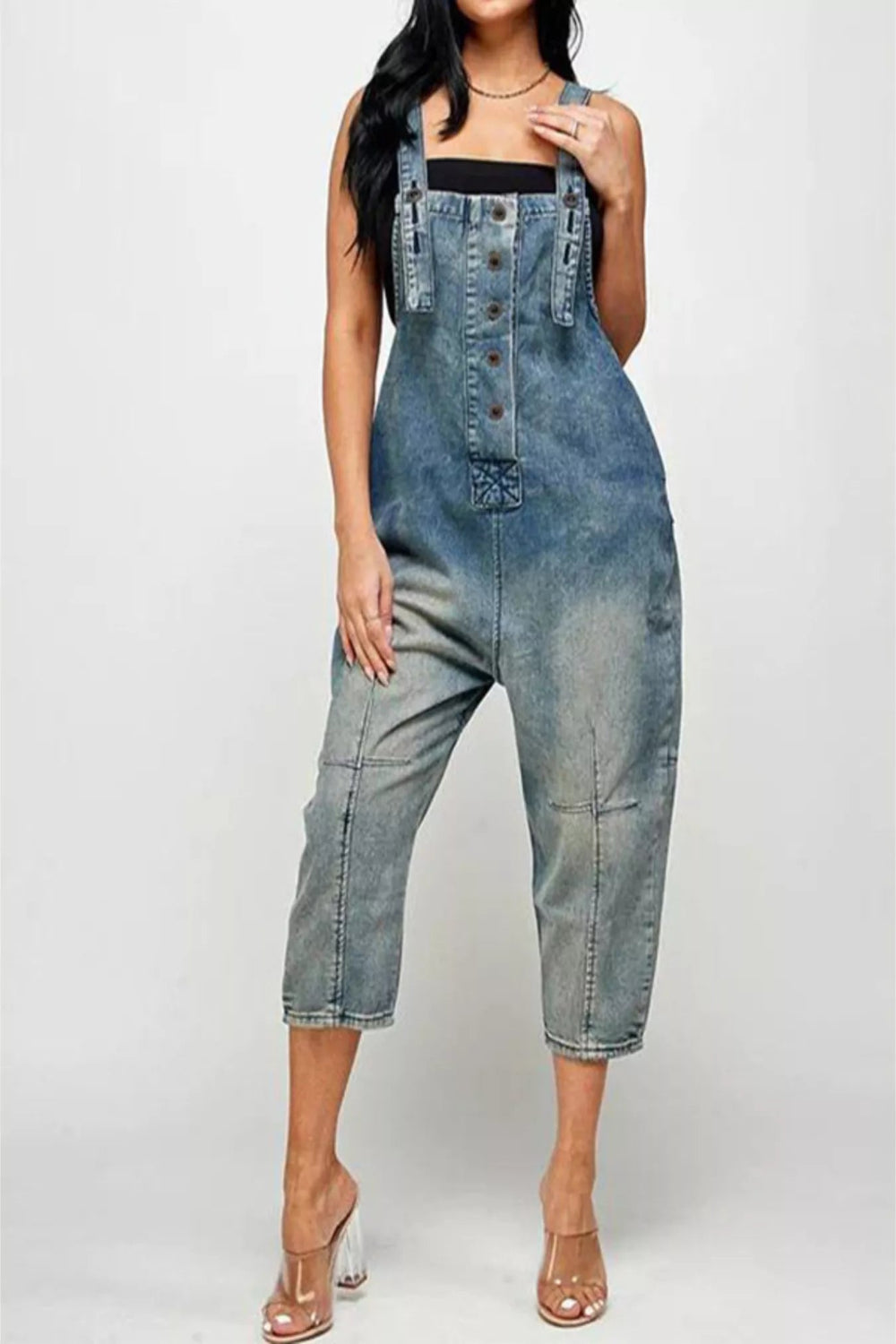 Denim button-front overalls with front and side pockets, casual style by Trendsi, shown on a model.