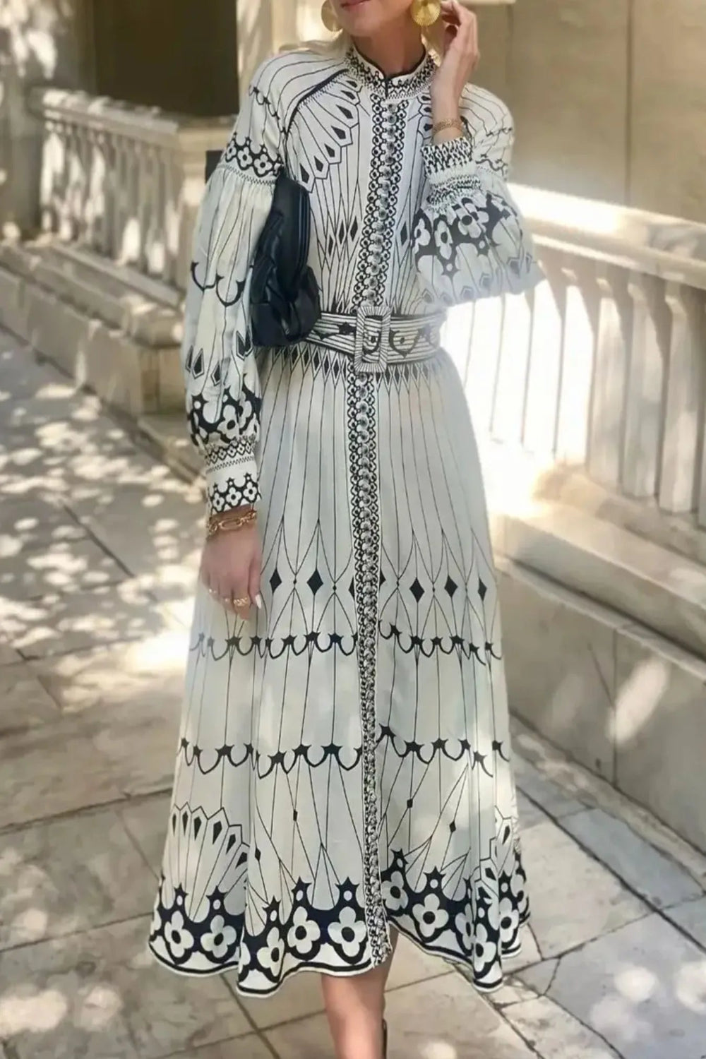 Printed Trendsi shirt dress with belt, lightweight and stylish, featuring a button-up front and a tie waist for a flattering fit.