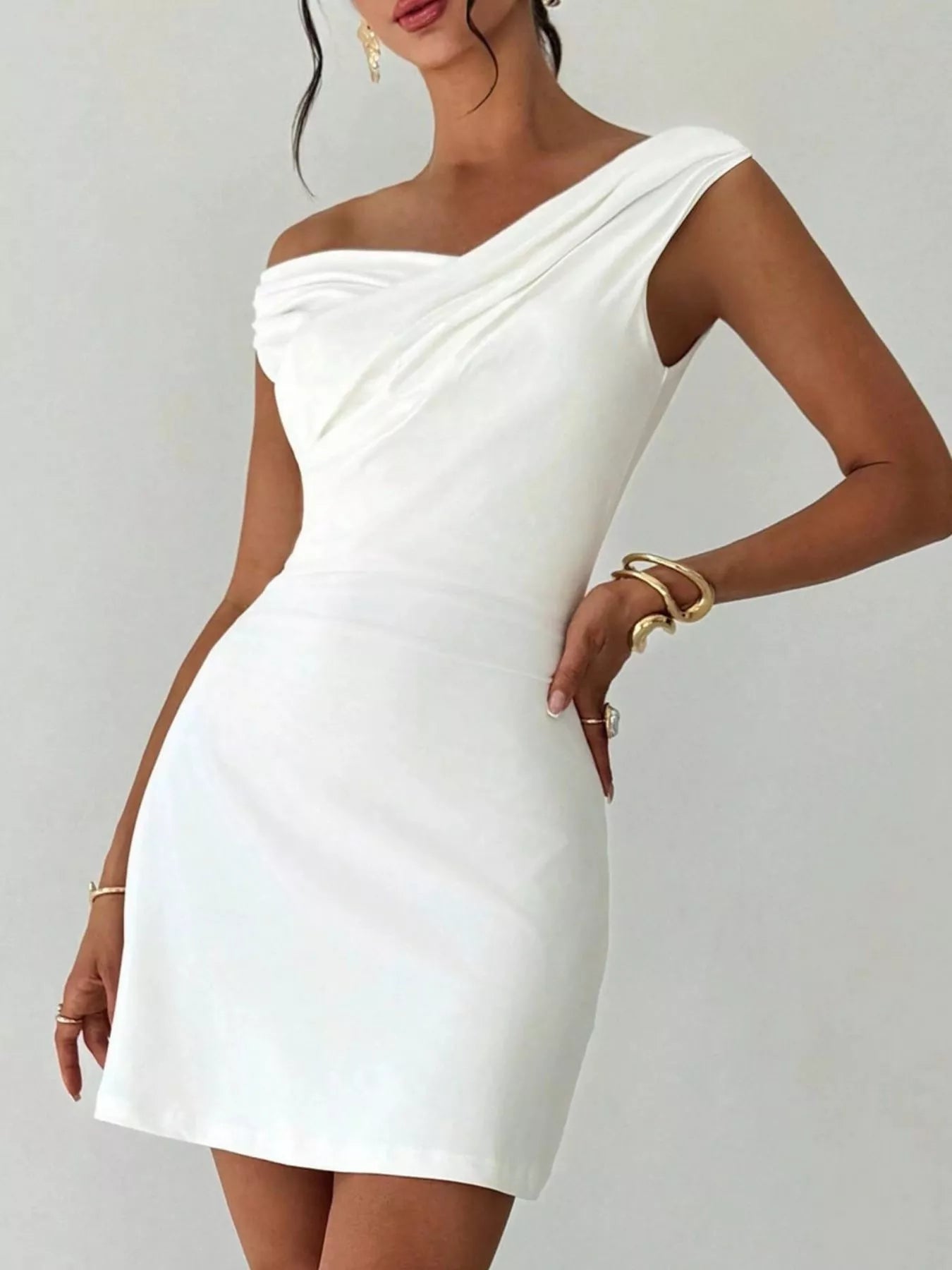 Elegant off-shoulder draped mini dress from Trendsi, perfect for after-5 occasions, showcasing a stylish and sophisticated design.