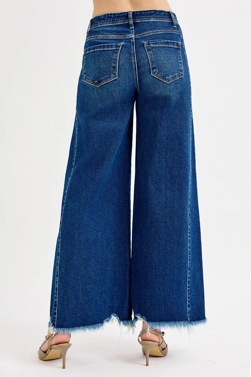 Light blue frayed hem high-rise ankle wide jeans from Trendsi, showcasing distressed denim with a relaxed fit and wide leg silhouette.