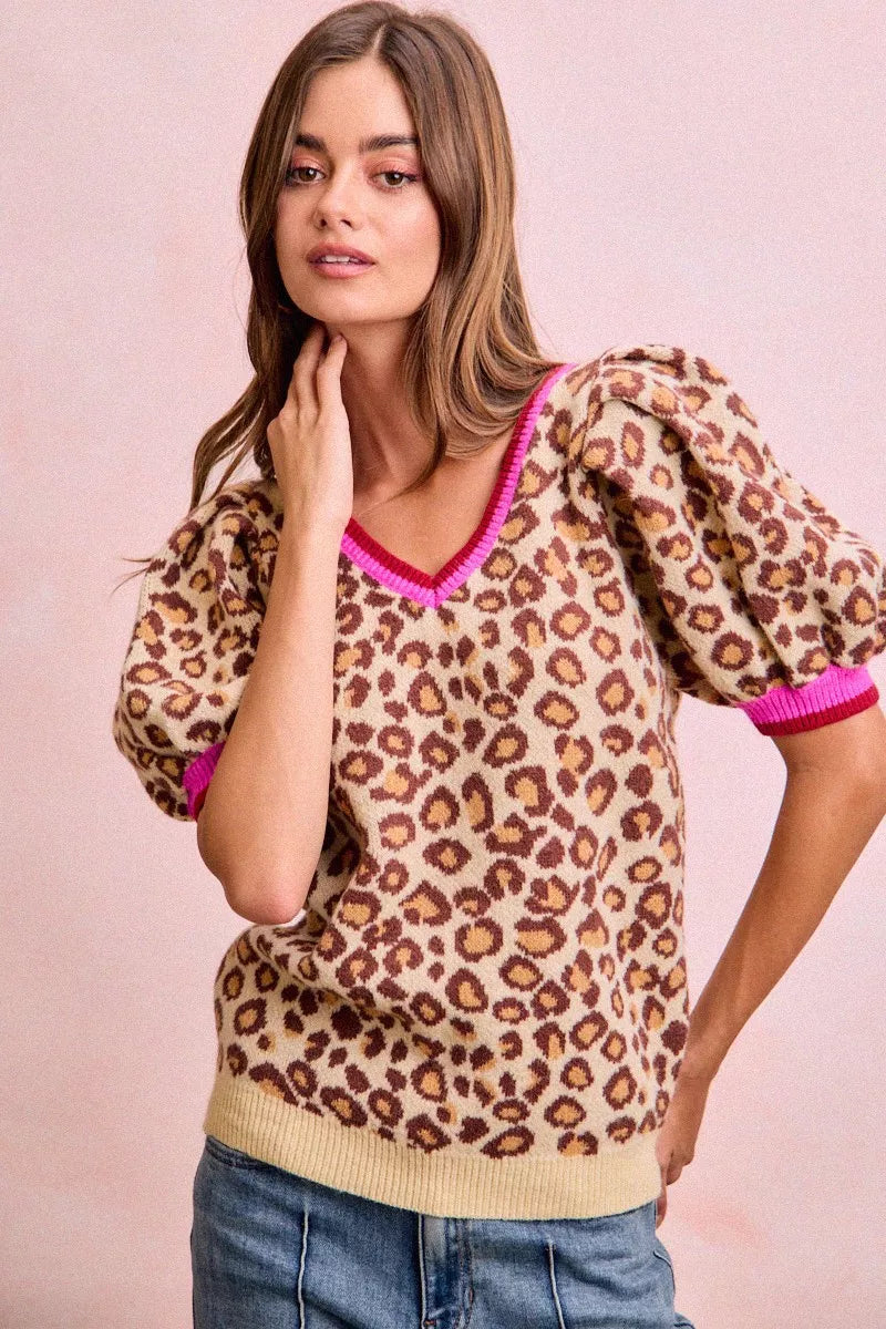 Leopard pattern puff sleeve V-neck sweater top by Trendsi, featuring a stylish design and soft knit fabric.