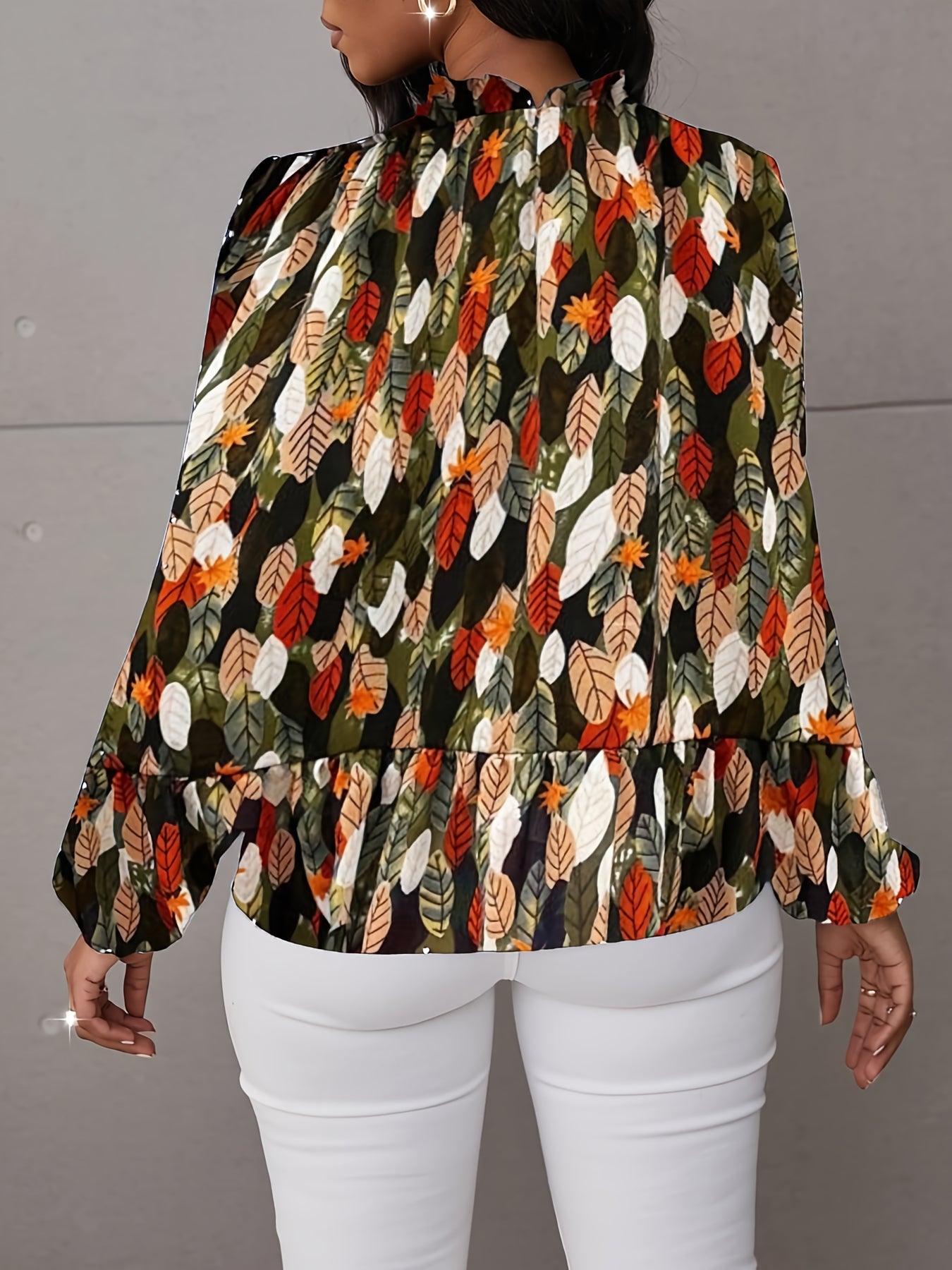 Nature-inspired blouse by Toshe Women's Fashions featuring floral patterns and lightweight fabric, displayed on a hanger.