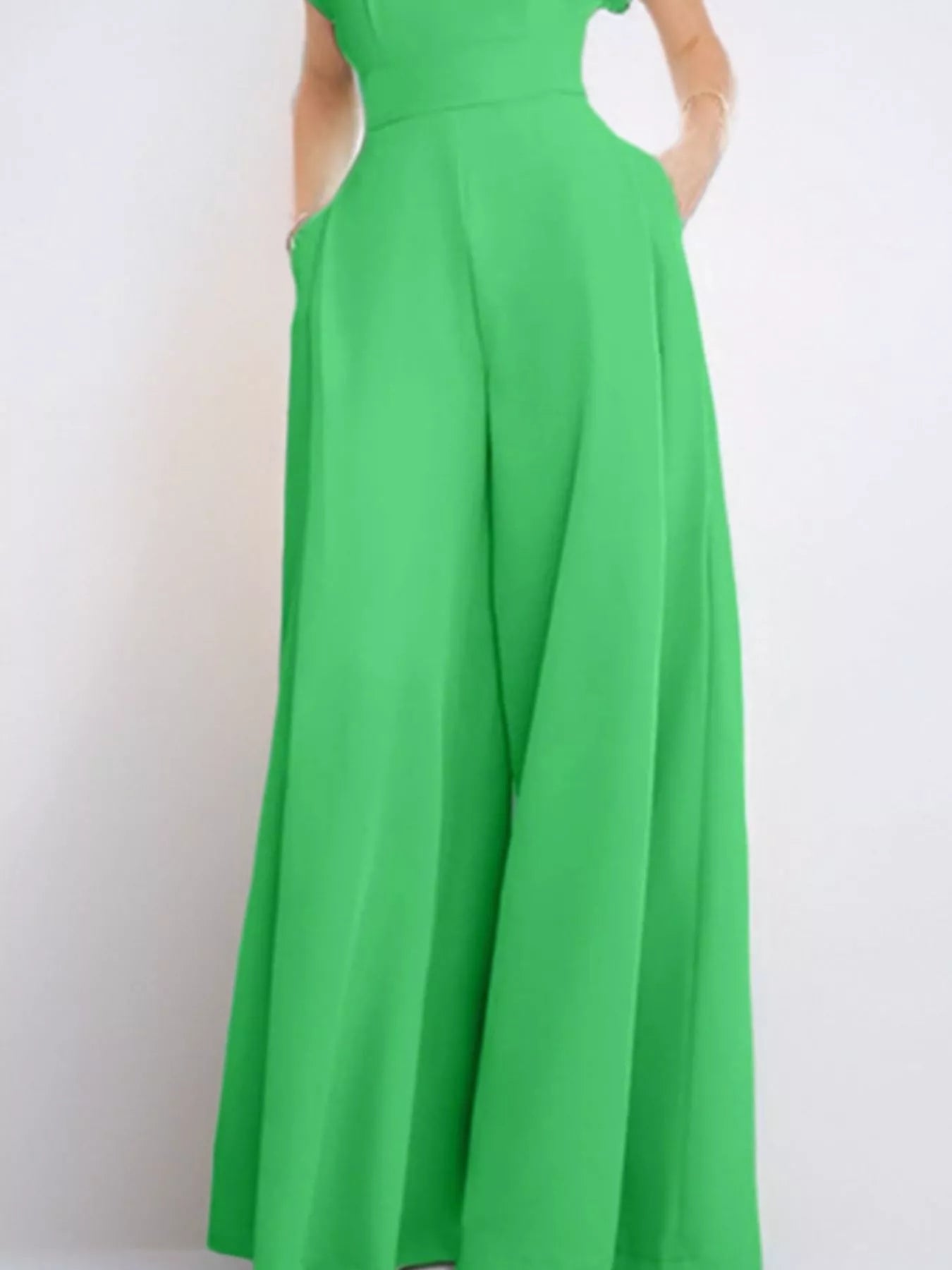 Notched wide-leg jumpsuit by Trendsi featuring a stylish fit, with wide legs and a modern design, shown in a flattering pose.