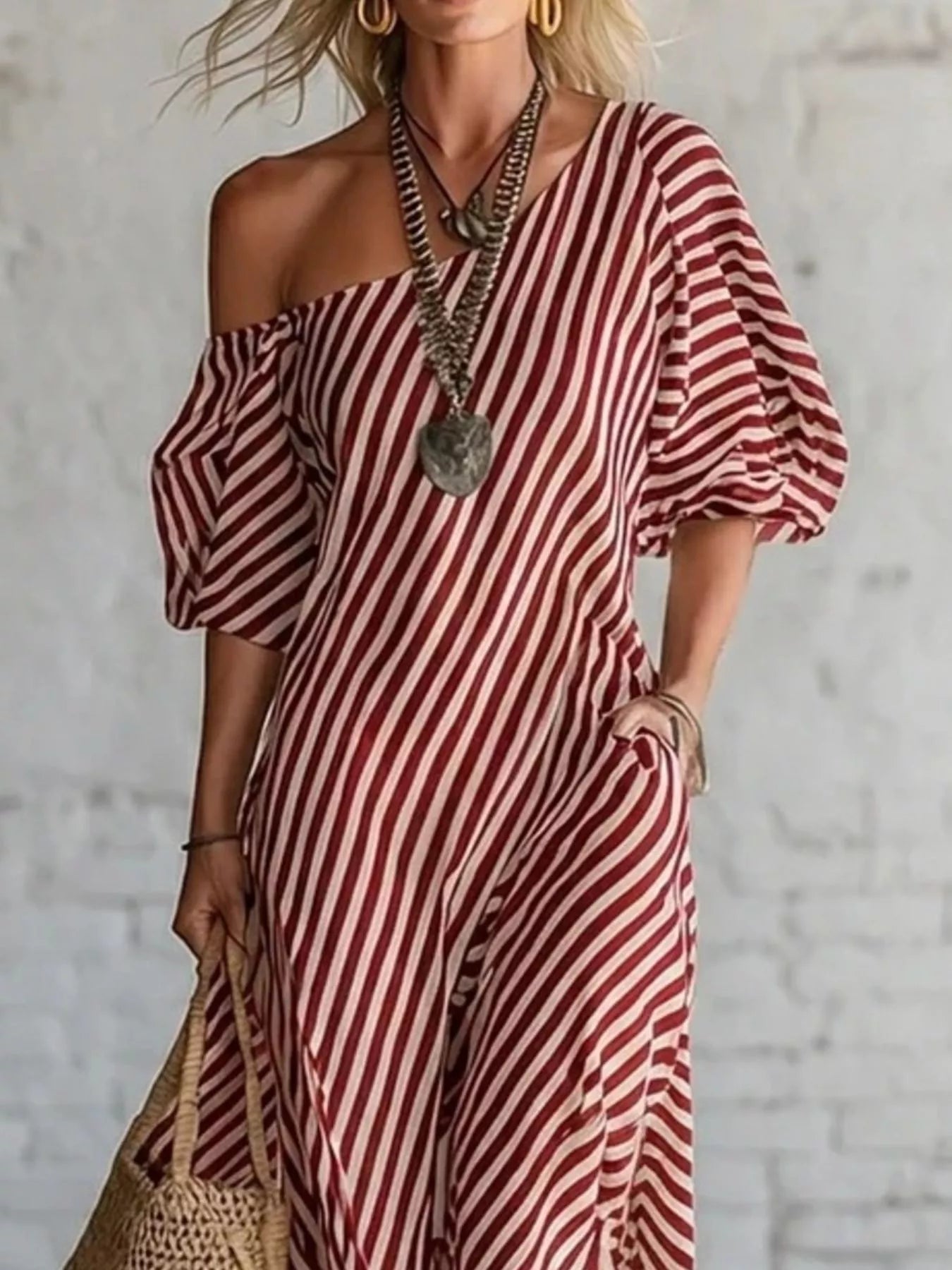 Striped one-shoulder maxi dress by Trendsi featuring a flowing silhouette and bold pattern, perfect for summer or casual occasions.