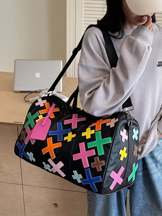 Colorful cross pattern travel duffel bag with sturdy handles, designed for versatile use and stylish travel accessories.