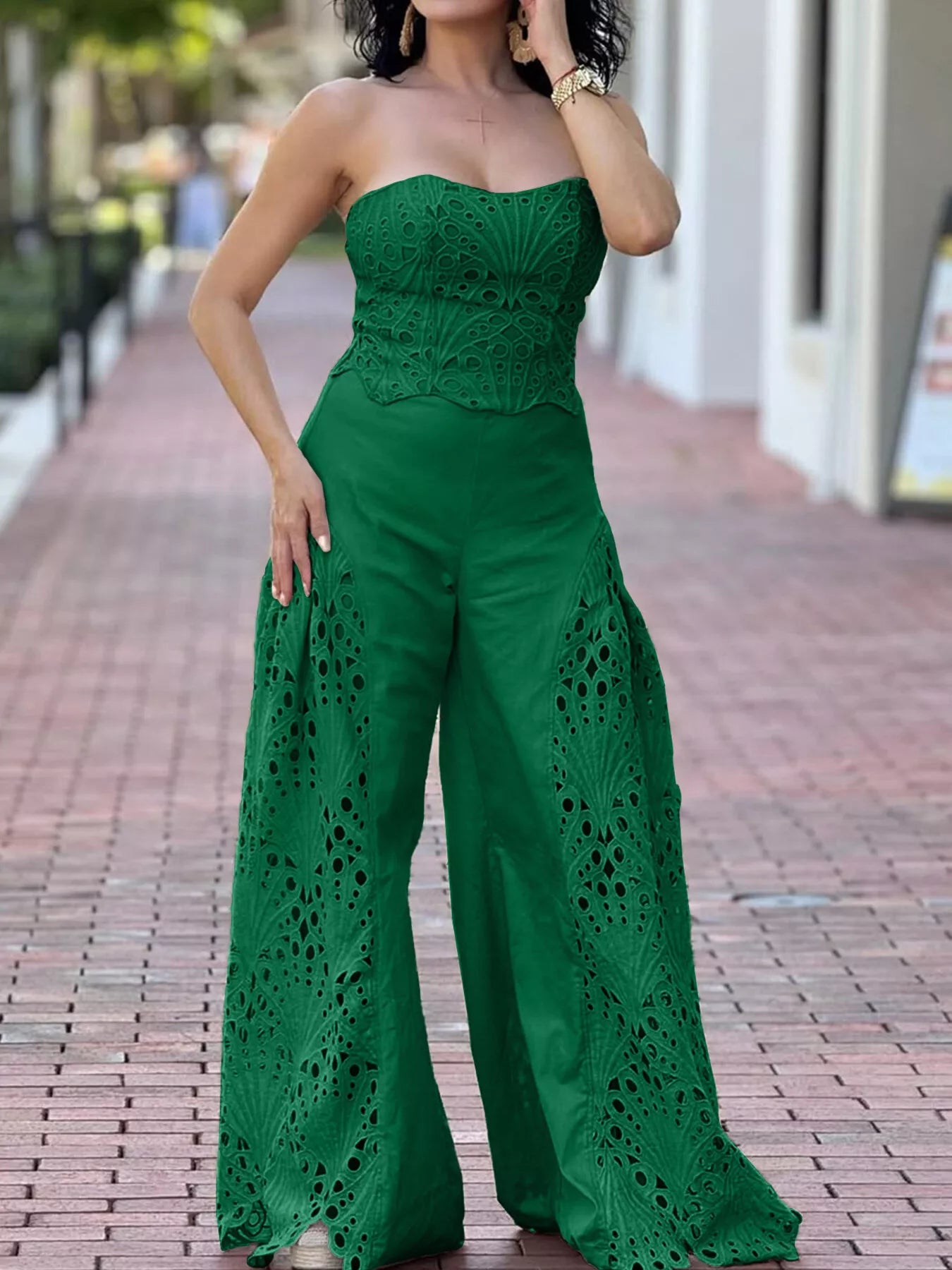 Hollow-out tube top and matching pants set by Trendsi, stylish 2-piece outfit with cut-out details and modern design.