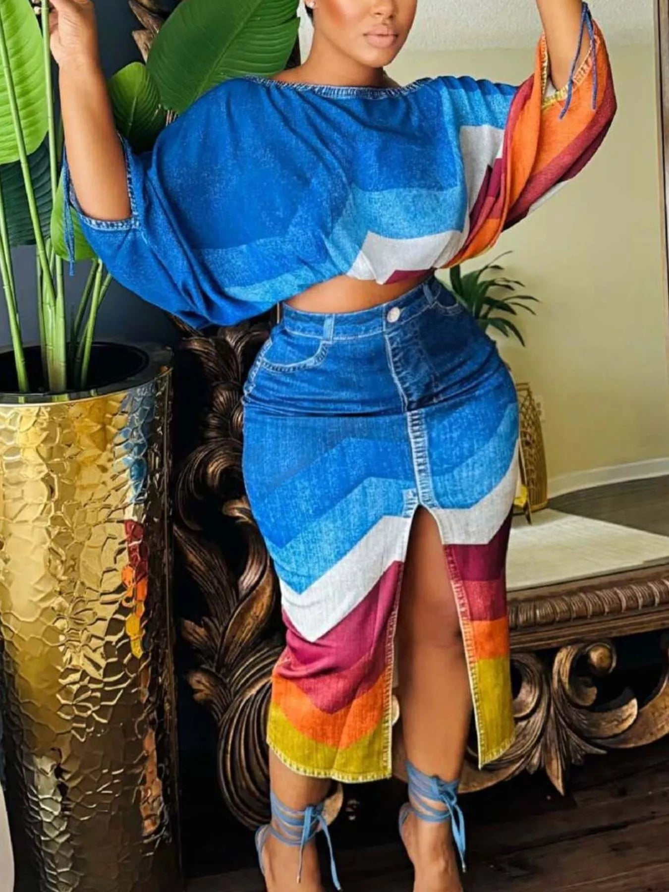 Blue one-shoulder top and slit skirt set by Trendsi, featuring a stylish coordinated skirt and top for a chic look.