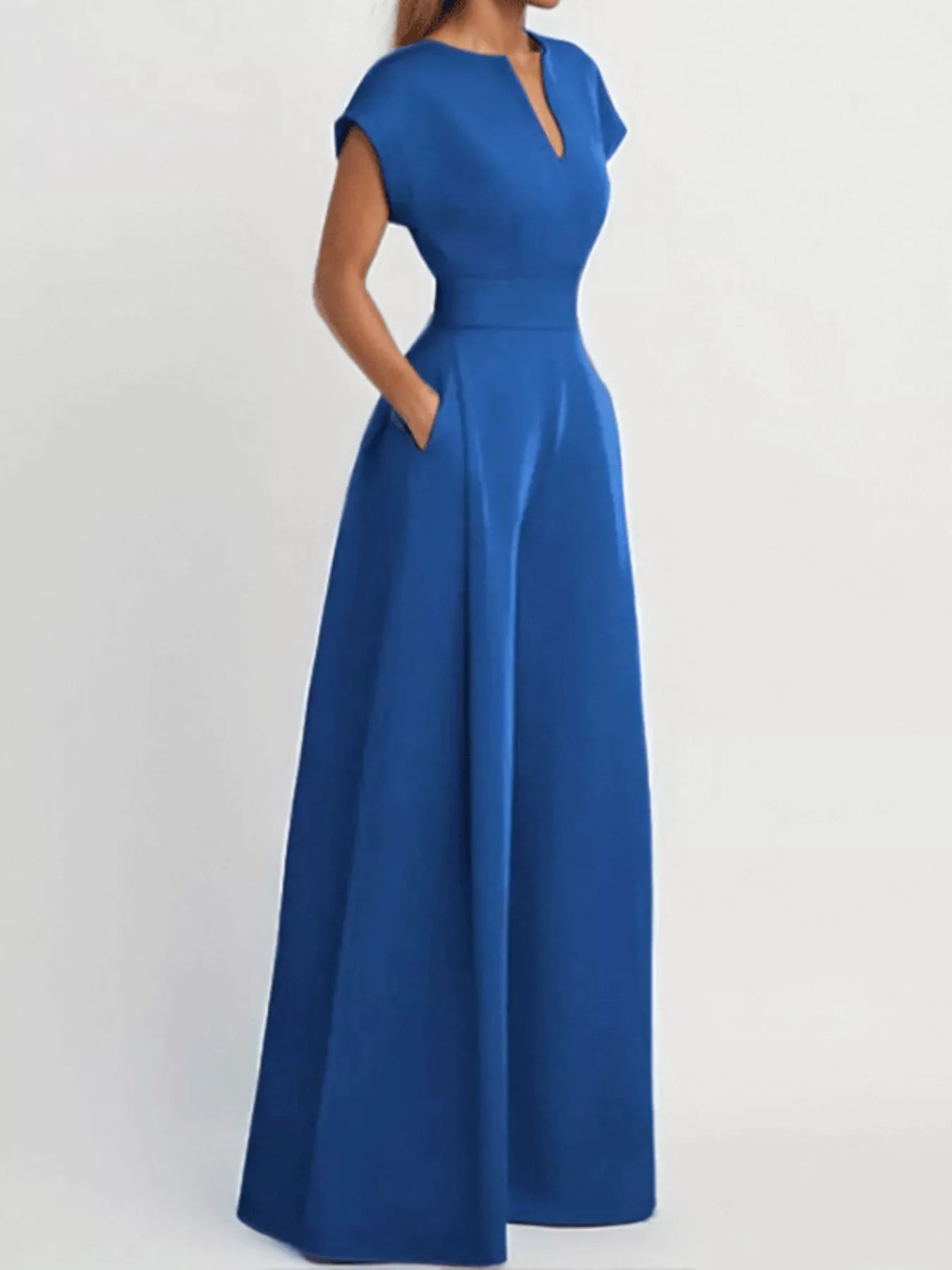 Notched wide leg jumpsuit by Trendsi featuring a fitted bodice, wide legs, and stylish notched neckline, displayed on a mannequin.