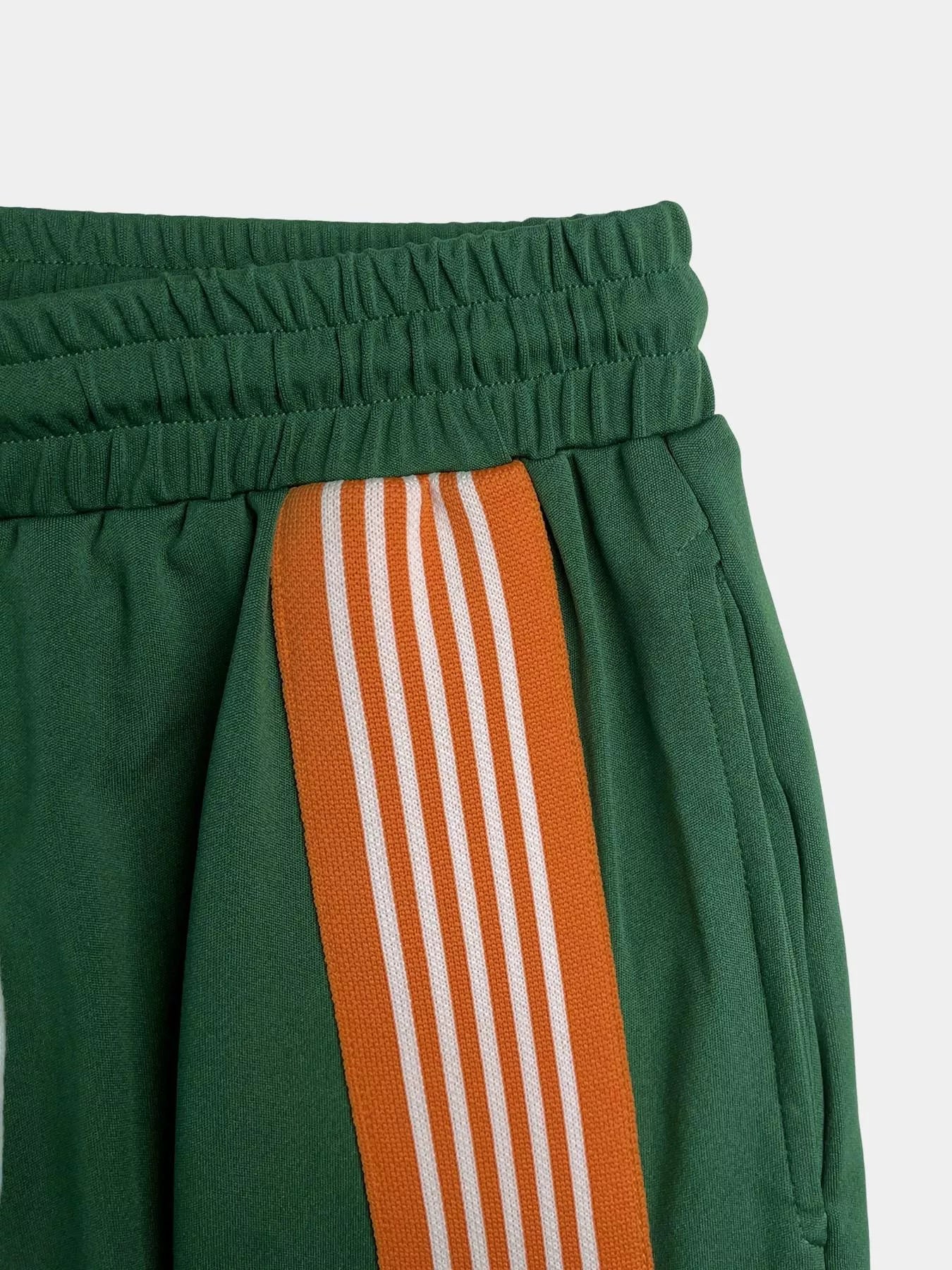 Striped detail top and drawstring pants set by Trendsi, featuring a stylish 2-piece pants set with bold stripe accents.