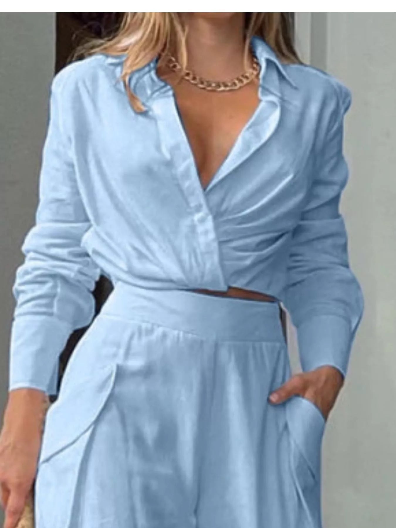 Button front shirt with front pocket and wide-leg pants set by Trendsi, featuring a coordinated stylish top and matching flowy pants.