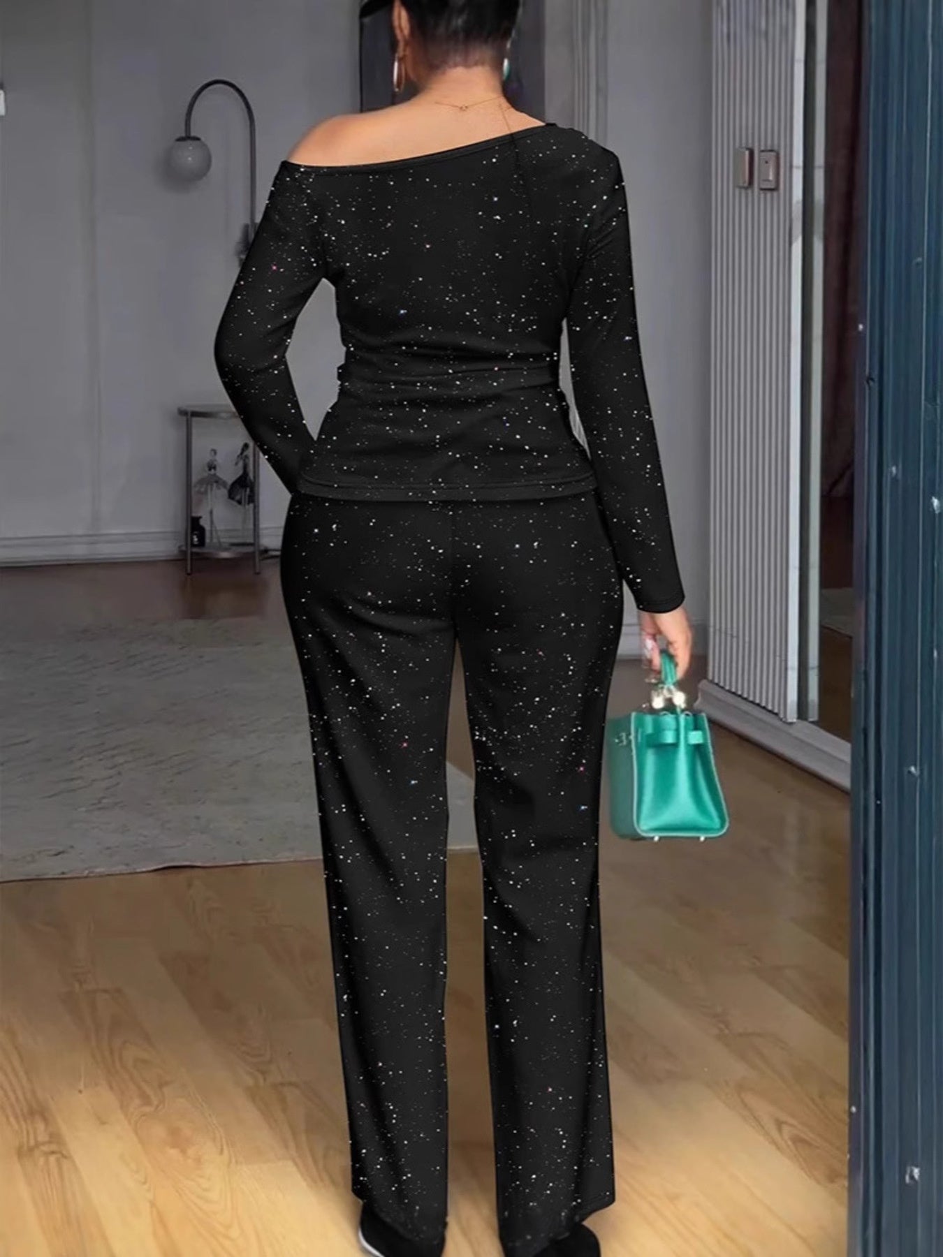 Black glitter top and pants evening set by Trendsi, featuring a sparkly, stylish outfit for special occasions.