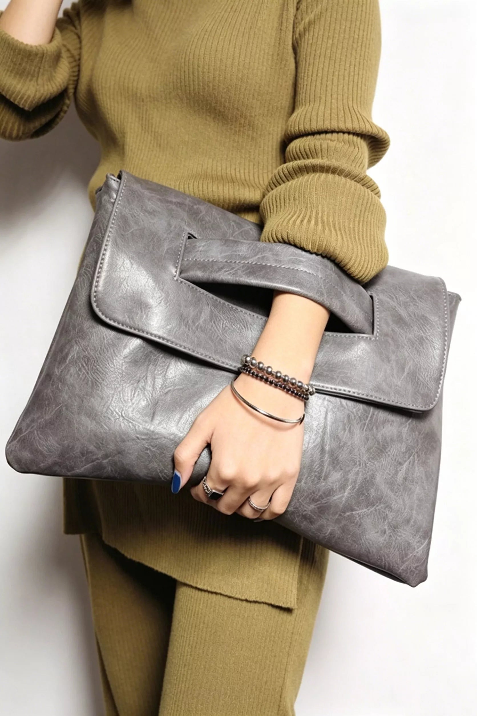 Vintage style envelope clutch handbag by Trendsi, featuring a sleek design and elegant closure, ideal for evening and formal occasions.