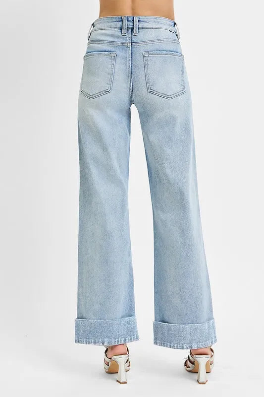 Wide cuffed high-rise ankle jeans by Trendsi, made of denim, featuring a fitted waist and cropped leg with wide cuffs.