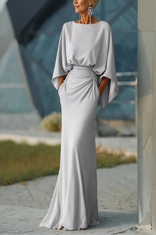 Black batwing sleeve ruched evening dress by Trendsi featuring elegant draped fabric and a sophisticated design.