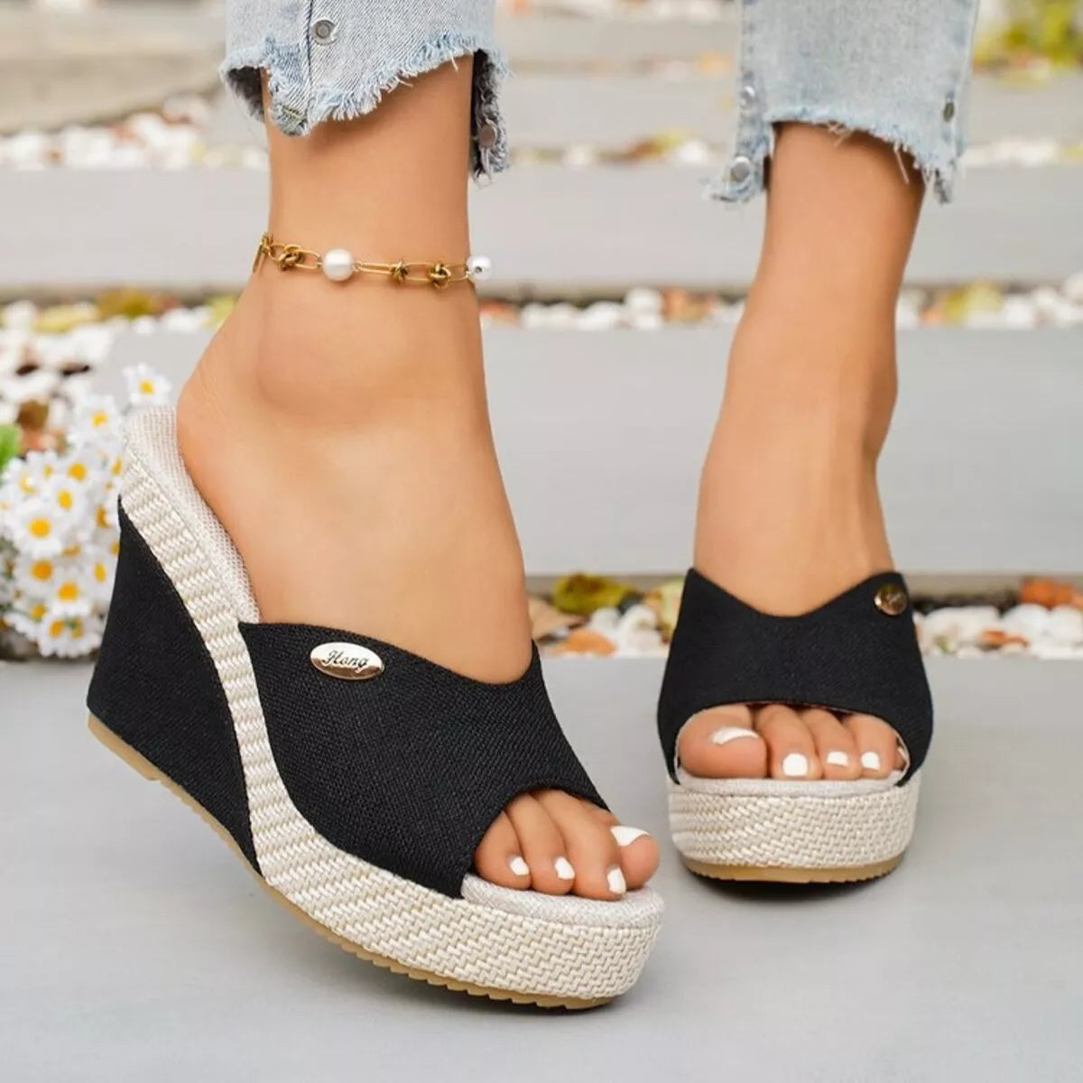 Open toe wedge sandals from Trendsi featuring a stylish design with a comfortable heel and open-toe style.
