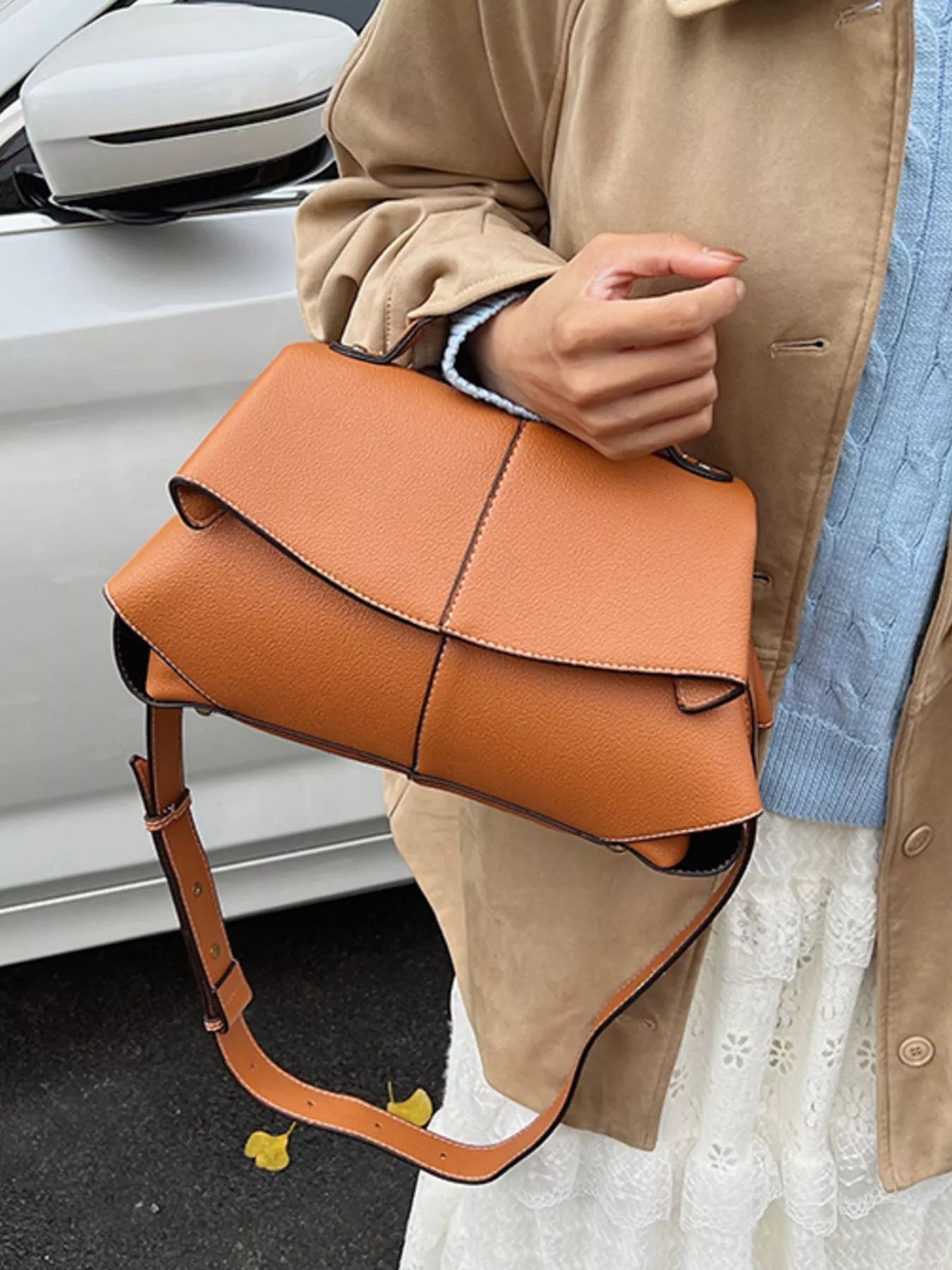 Geometric flap shoulder bag by Trendsi, stylish handbag with angular design and top handle, perfect for casual or evening wear.