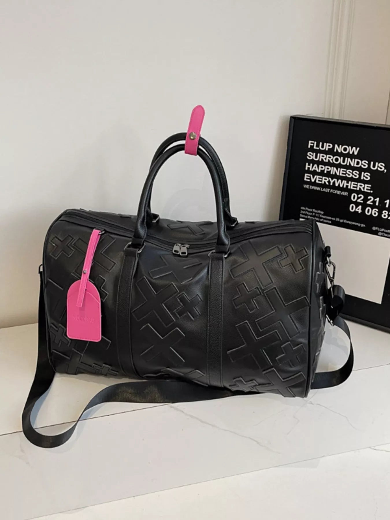 Colorful cross pattern travel duffel bag from Trendsi, featuring a spacious design and vibrant hand-painted cross motifs.