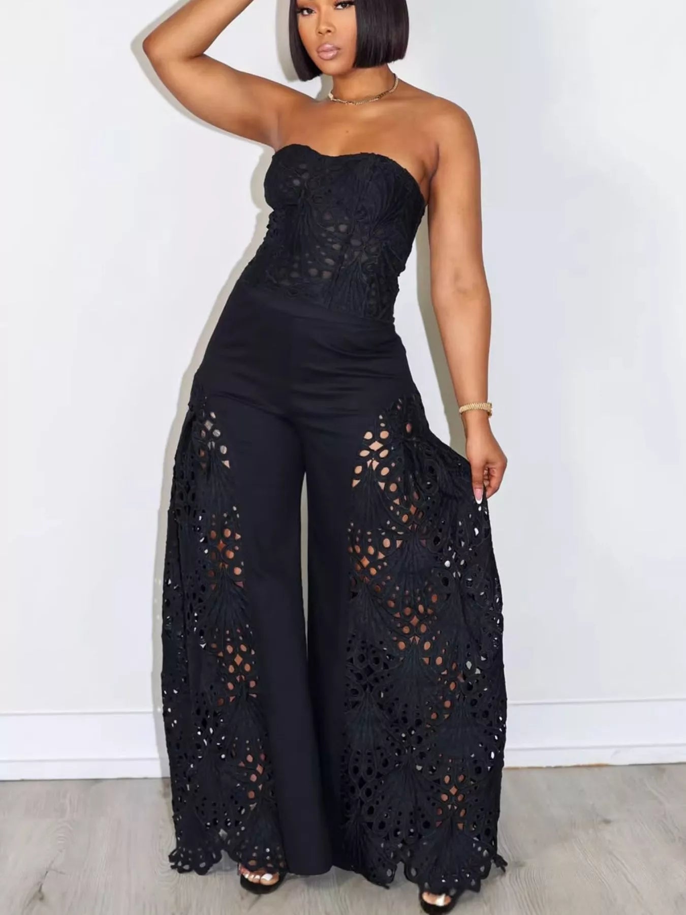 Trendsi matching set with cutout tube top and wide-leg pants in a stylish, coordinated fashion ensemble.